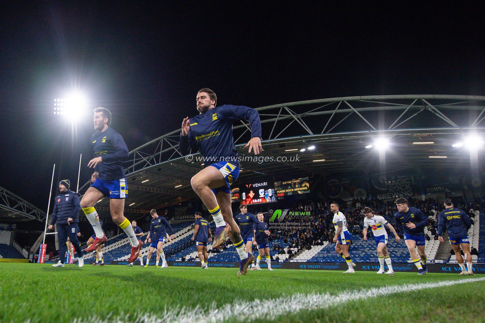 Greg Minikin #21 of Warrington Wolves stretches during pre match warm up ahead of the Betfred Super League Round 2 match Huddersfield Giants vs Warrington Wolves at John Smith's Stadium, Huddersfield, United Kingdom, 24th February 2023

(Photo by Craig Thomas/News Images)