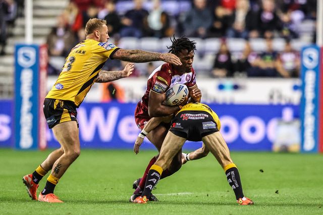 Junior Nsemba of Wigan Warriors is tackled by Jacob Atkin of Castleford Tigers during the Betfred Super League Round 26 match Wigan Warriors vs Castleford Tigers at The Brick Community Stadium, Wigan, United Kingdom, 12th September 2025

(Photo by Alfie Cosgrove/News Images)