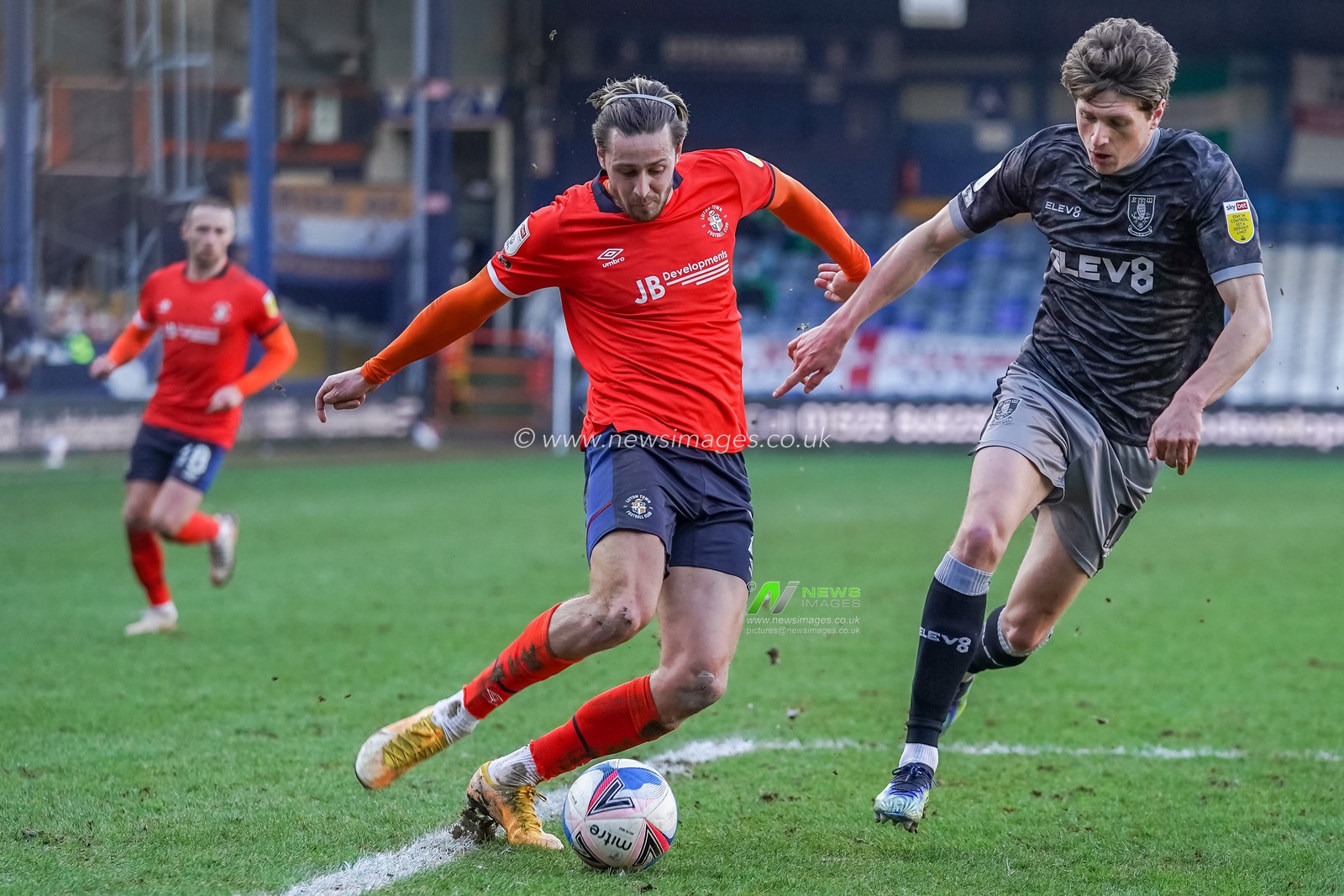 Harry Cornick #7 of Luton Town battles with Adam Reach #11 of Sheffield Wednesday