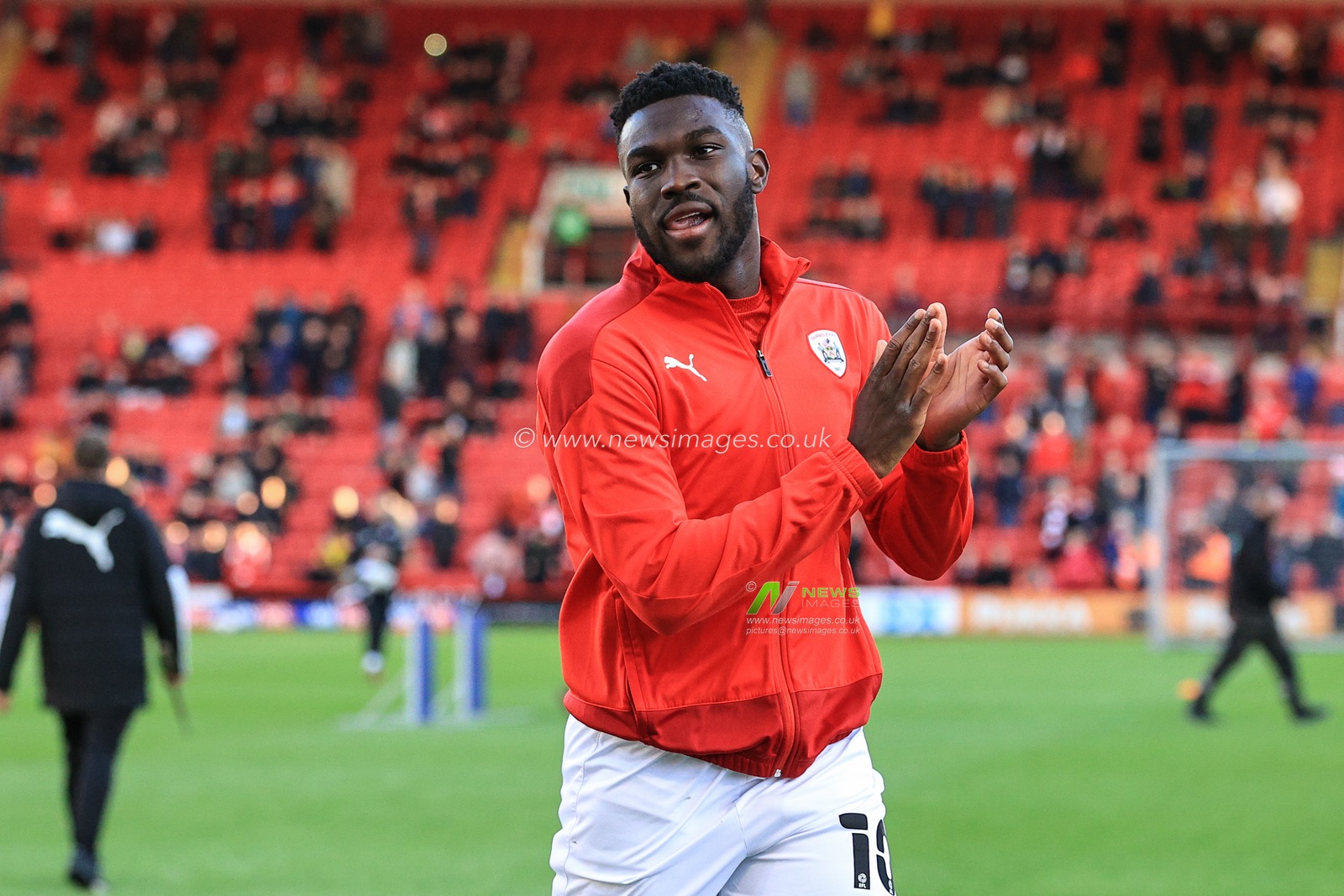 Daryl Dike #10 of Barnsley applauds the Barnsley fans as they meet for the first time