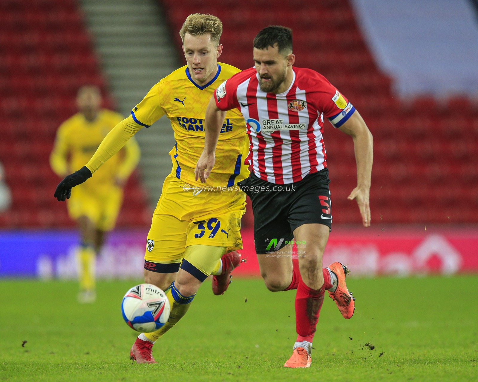 Sunderland goalscorer Bailey Wright #5, under pressure from AFC Wimbledon goalscorer Joe Pigott #39