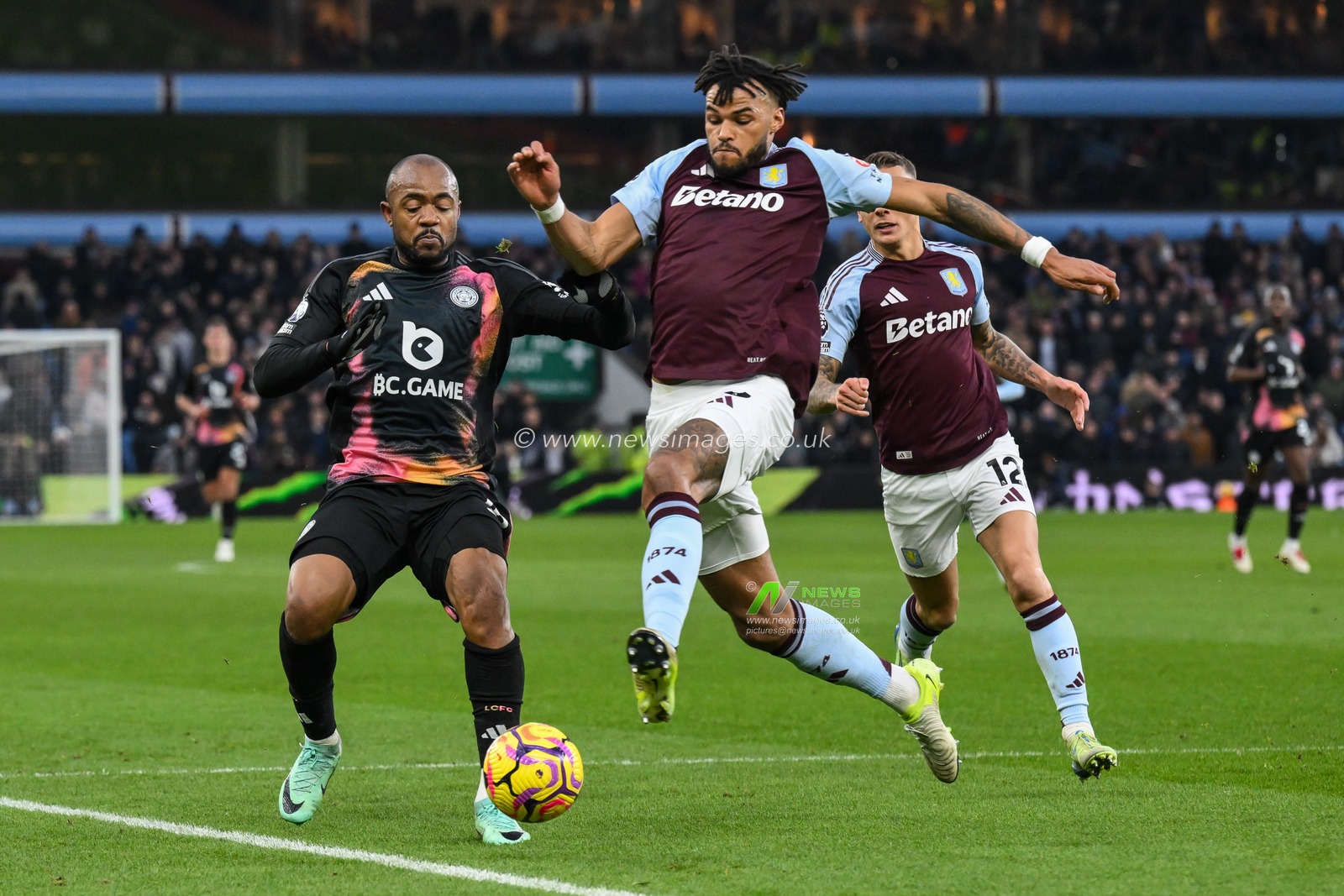 Tyrone Mings of Aston Villa clears the ball ahead of Jordan Ayew of Leicester City during the Premier League match Aston Villa vs Leicester City at Villa Park, Birmingham, United Kingdom, 4th January 2025

(Photo by Craig Thomas/News Images)