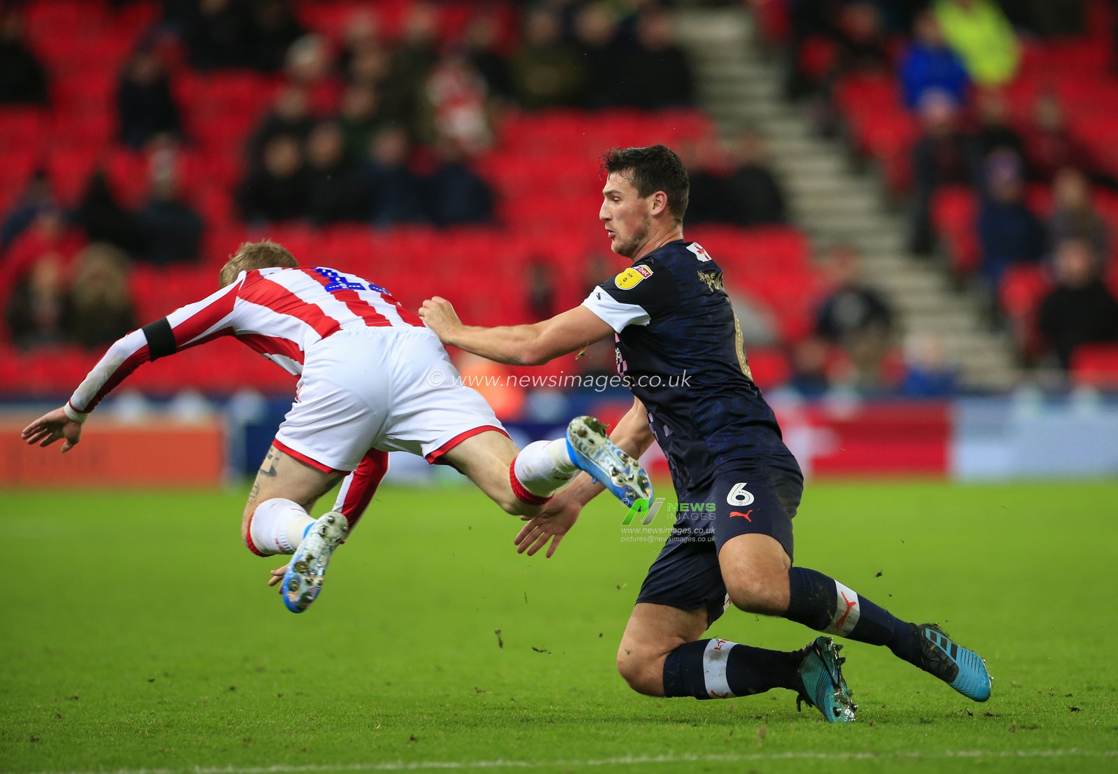 10th December 2019, Bet365 Stadium, Stoke-on-Trent, England; Sky Bet Championship, Stoke City v Luton Town : James McClean (11) of Stoke City is fouled by Matty Pearson (6) of Luton Town

Credit: Conor Molloy/News Images