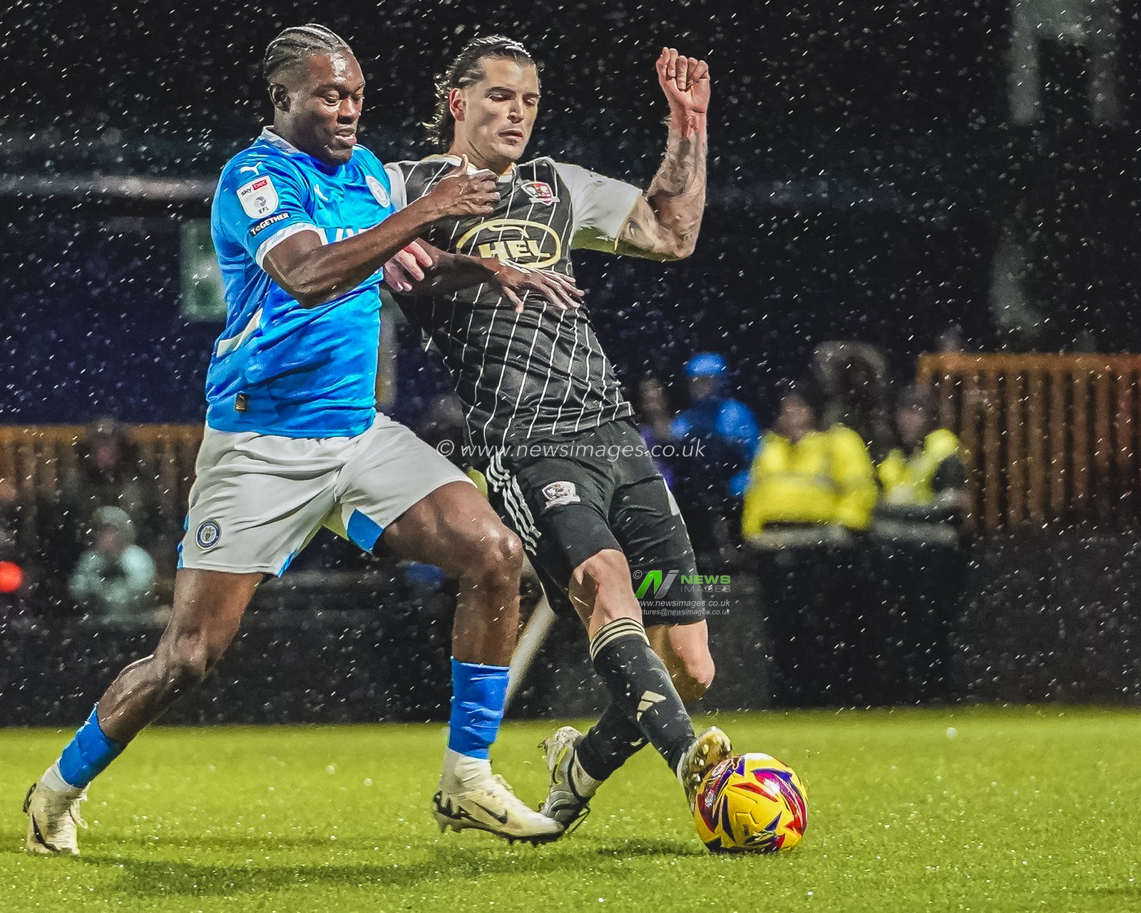Stockport County Forward Isaac Olaofe battling for the ball with Exeter City Defender Tristan Crama during the Sky Bet League 1 match Stockport County vs Exeter City at Edgeley Park Stadium, Stockport, United Kingdom, 7th December 2024

(Photo by James Giblin/News Images)