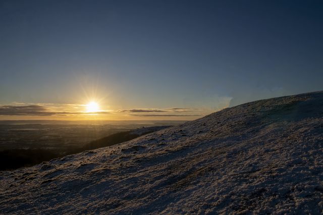 The Sun rises for the last time in 2020 over the Malvern Hills near Aonb, Worcestershire