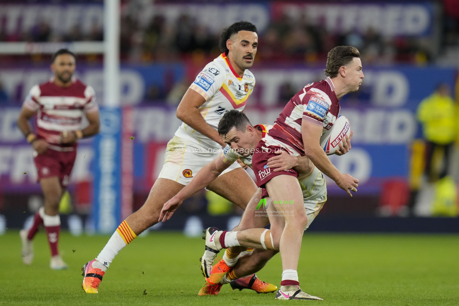 Jai Field #1 of Wigan Warriors is held in the tackle during the Betfred Super League Grand Final match Wigan Warriors vs Catalans Dragons at Old Trafford, Manchester, United Kingdom, 14th October 2023

(Photo by Steve Flynn/News Images)