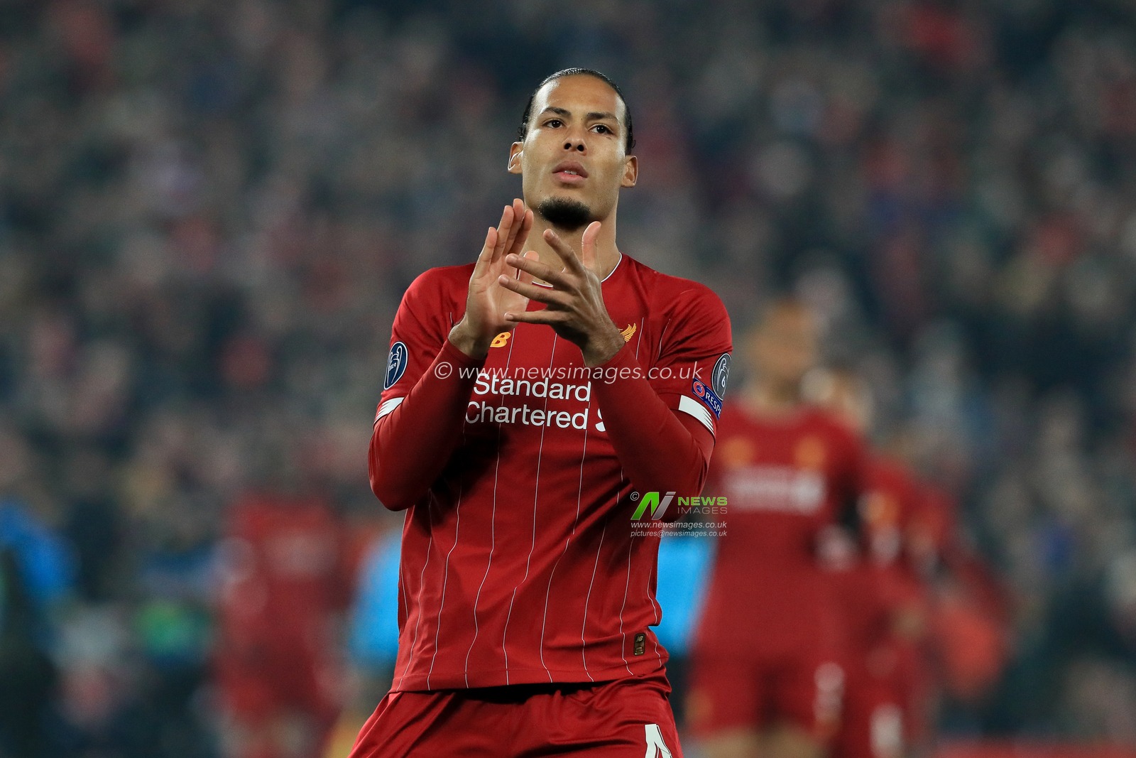 5th November 2019, Anfield, Liverpool, England; UEFA Champions League, Liverpool v KRC Genk : Virgil van Dijk (4) of Liverpool applaudes the Liverpool supporters 

Credit: Mark Cosgrove/News Images