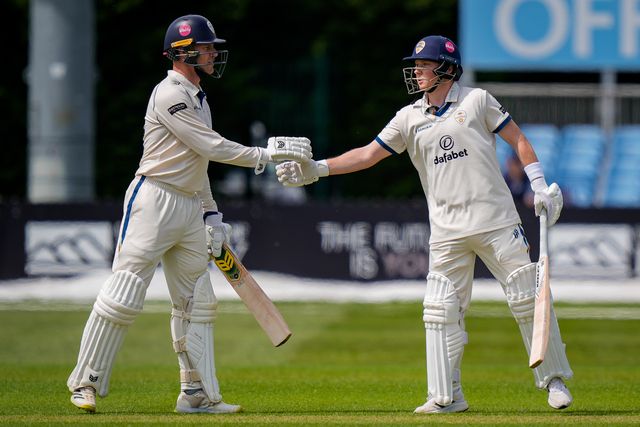 Harry Came of Derbyshire celebrates reaching his 50 by shaking hands with Luise Reece of Derbyshire upon reaching his half century during the County Championship Division Two Derbyshire vs Northamptonshire day one match at The Central Co-Op County Ground, Derby, United Kingdom on 08 May 2026

(Photo by Maynard Manyowa/News Images)