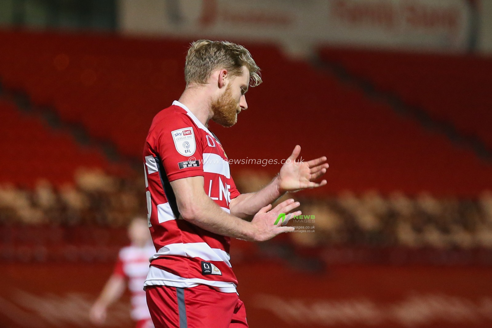 Josh Sims #20 of Doncaster Rovers reacts during the game