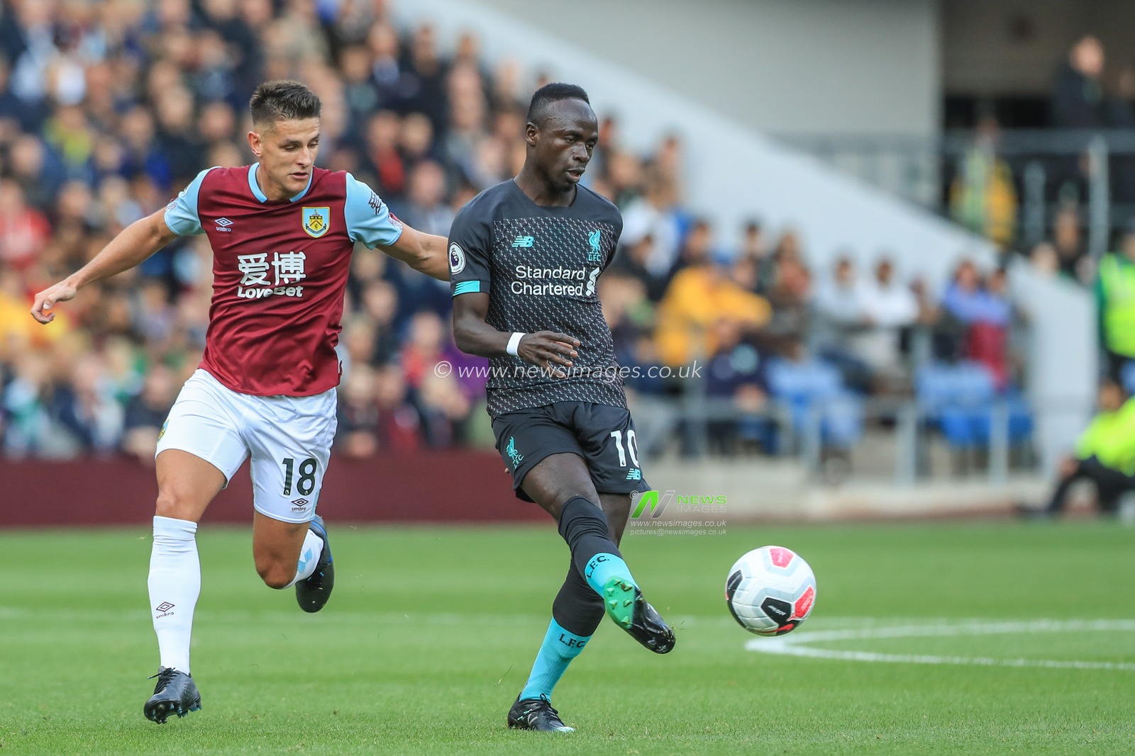 31st August 2019, Turf Moor, Burnley, England ; Premier League Football, Burnley vs Liverpool : Sadio Mane (10) of Liverpool poses the ball

Credit: Mark Cosgrove/News Images

English Football League images are subject to DataCo Licence