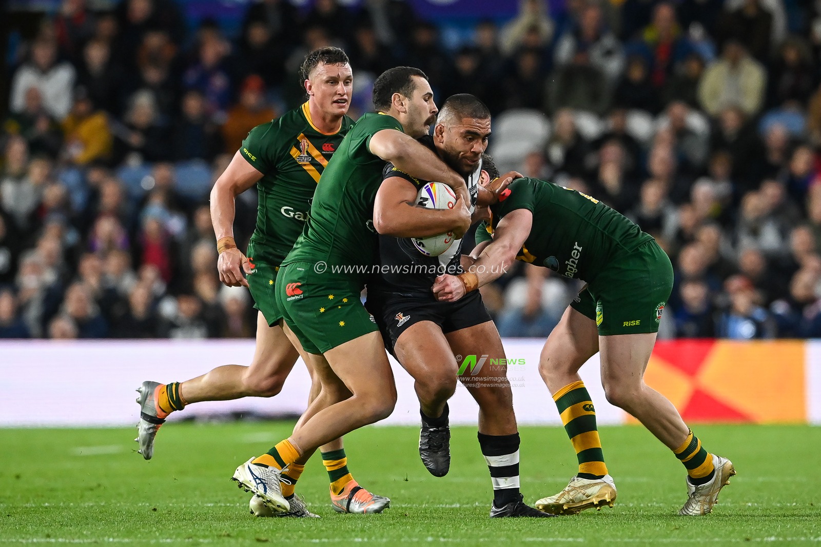 Isaiah Papali'i of New Zealand is tackled by Liam Martin and Reagan Campbell-Gillard of Australia during the Rugby League World Cup 2021 Semi Final match Australia vs New Zealand at Elland Road, Leeds, United Kingdom, 11th November 2022

(Photo by Craig Thomas/News Images)