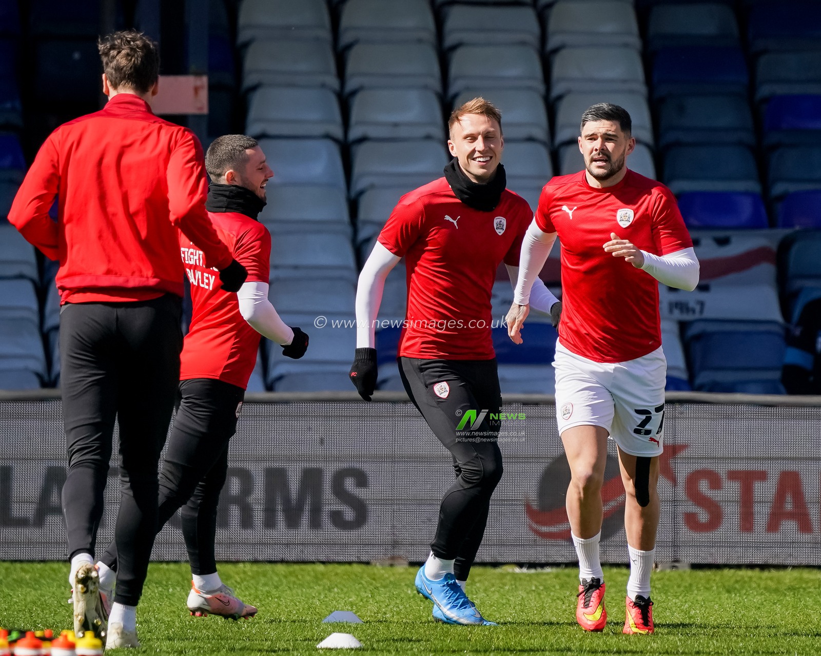 Alex Mowatt #27 of Barnsley and Cauley Woodrow #9 of Barnsley warm up prior to the game