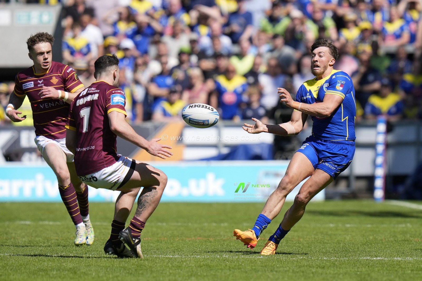 Matty Ashton of Warrington Wolves passes the ball during the Betfred Challenge Cup Semi-Final match Huddersfield Giants vs Warrington Wolves at Totally Wicked Stadium, St Helens, United Kingdom, 19th May 2024

(Photo by Steve Flynn/News Images)