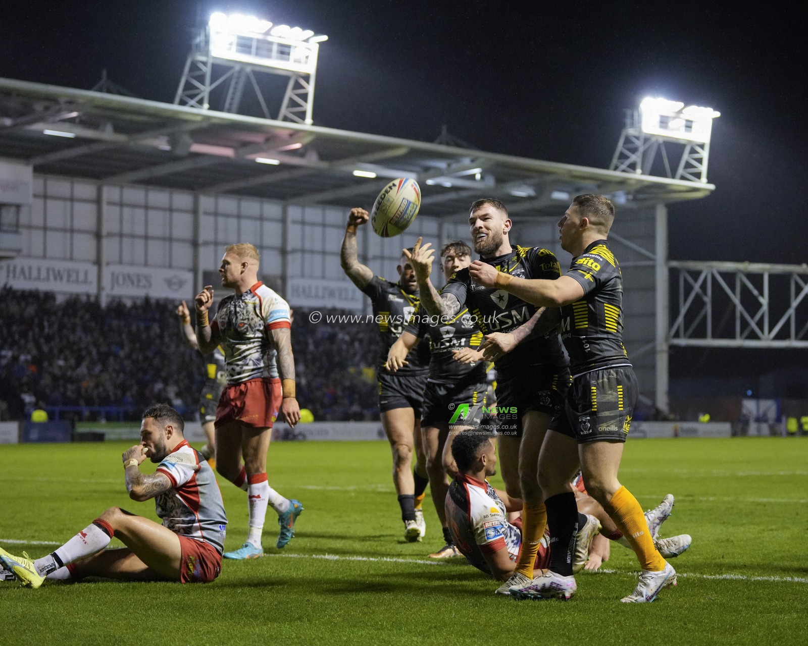 Daryl Clark #9 of Warrington Wolves celebrates after scoring a try during the Rugby League Ben Currie Testimonial match Warrington Wolves vs Leigh Leopards at Halliwell Jones Stadium, Warrington, United Kingdom, 4th February 2023

(Photo by Steve Flynn/News Images)