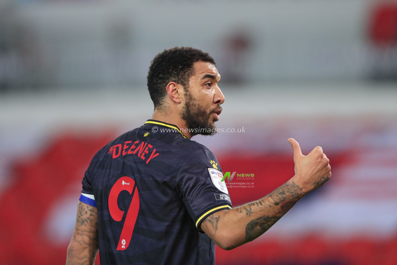 Troy Deeney #9 of Watford giving instructions to his team mate