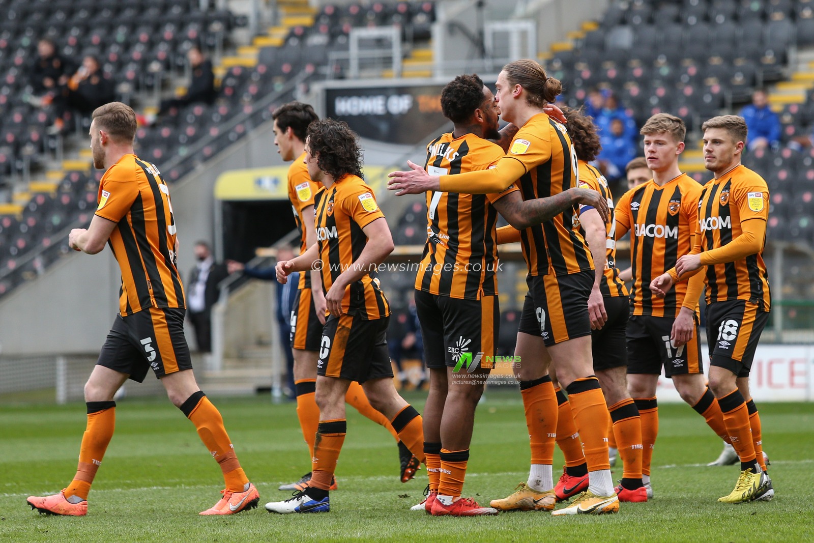Tom Eaves #9 of Hull City is congratulated by Mallik Wilks #7 of Hull City