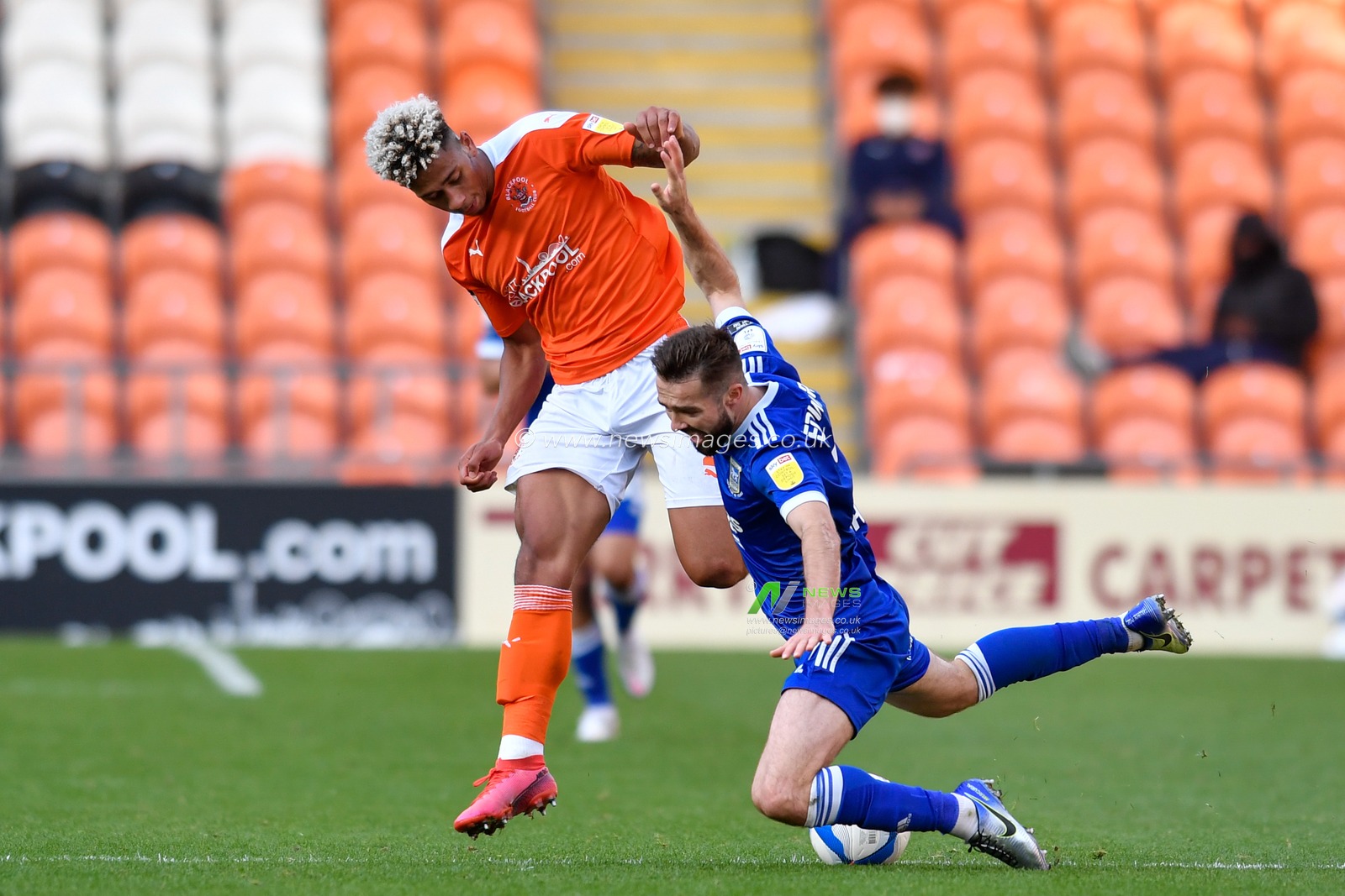 Jordan Lawrence-Gabriel (2) of Blackpool fouls Gwion Edwards (7) of Ipswich Town