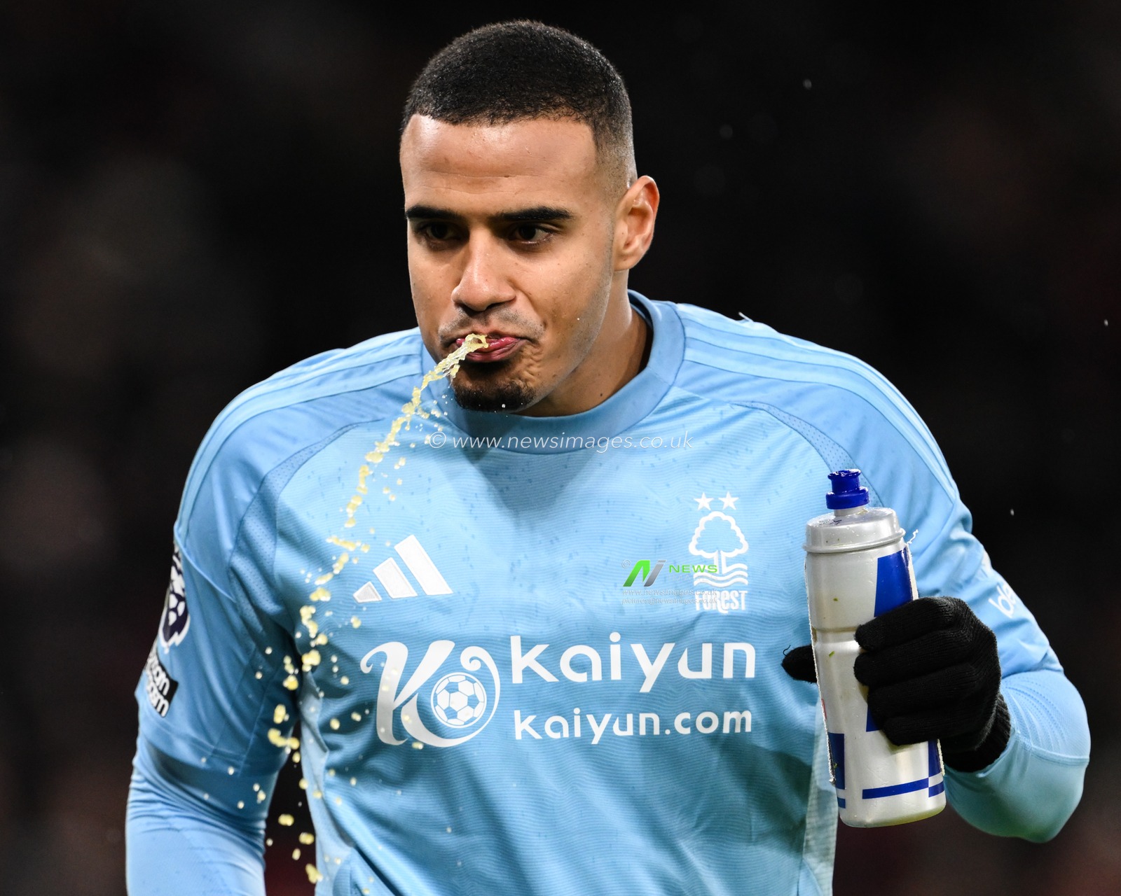 Murillo Santiago of Nottingham Forest spits out his drink during the Premier League match Manchester United vs Nottingham Forest at Old Trafford, Manchester, United Kingdom, 7th December 2024

(Photo by Craig Thomas/News Images)