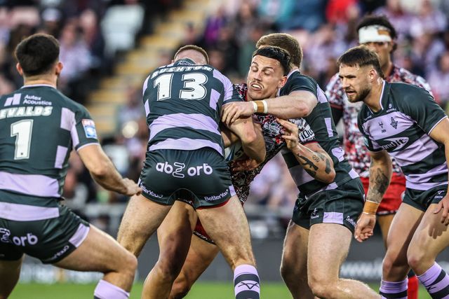 Owen Trout of Leigh Leopards is tackled by Harry Rushton of Huddersfield Giants during the Betfred Super League round 9 match Leigh Leopards vs Huddersfield Giants at Leigh Sports Village, Leigh, United Kingdom on 23 April 2026

(Photo by Alfie Cosgrove/News Images)