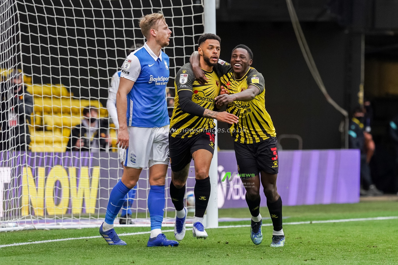 Andre Gray #18 of Watford celebrates scoring with Jeremy Ngakia #3 of Watford