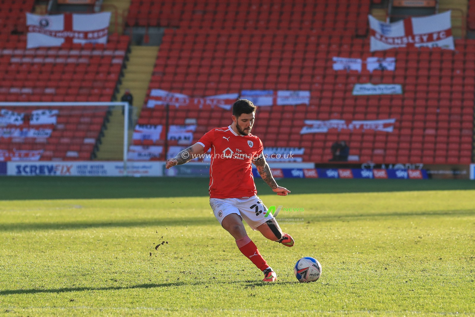 Alex Mowatt #27 of Barnsley takes a free-kick
