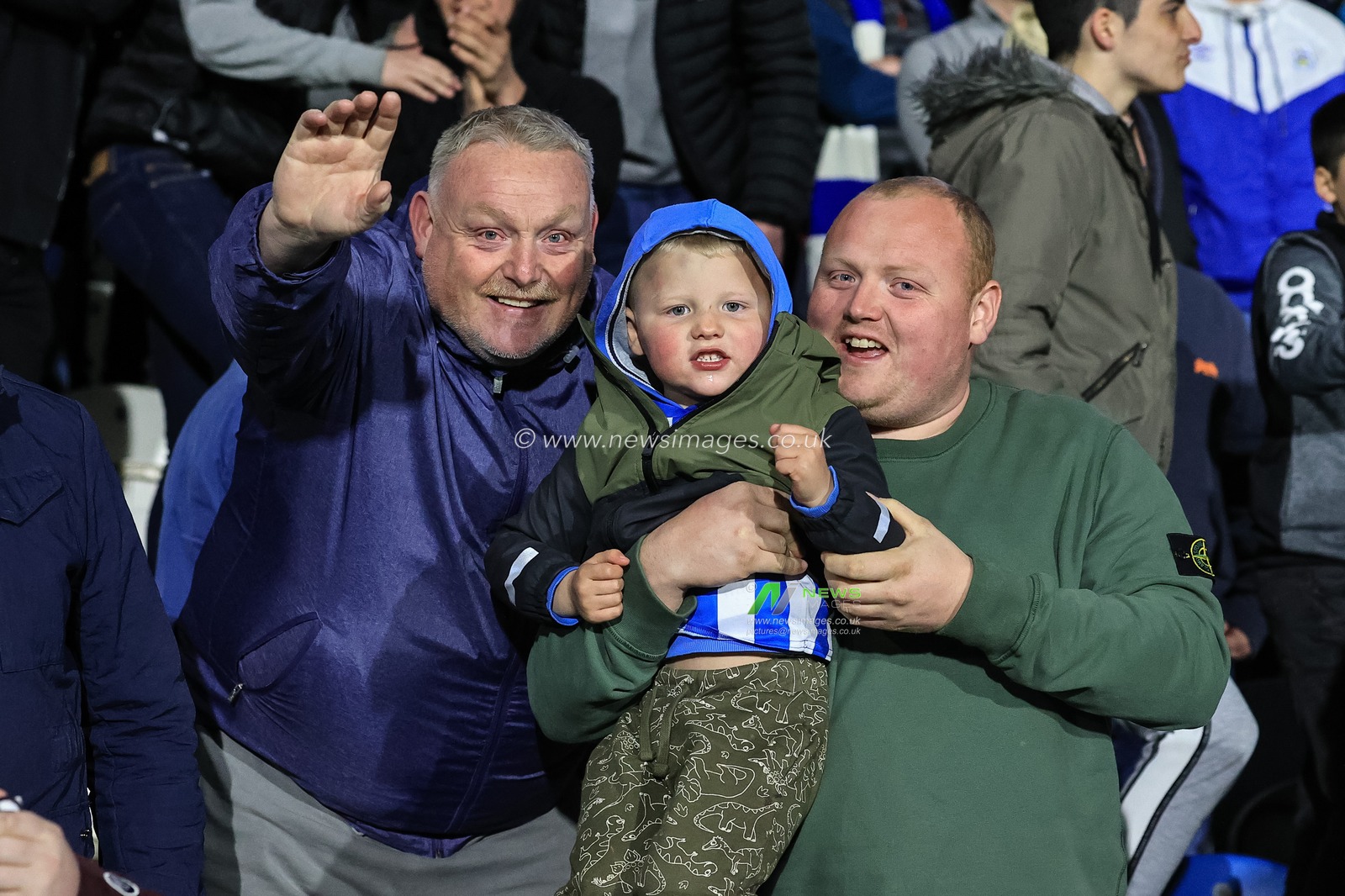 Huddersfield fans celebrate their 2-1 win over Barnsley and take a step closer to a return to the Premier League