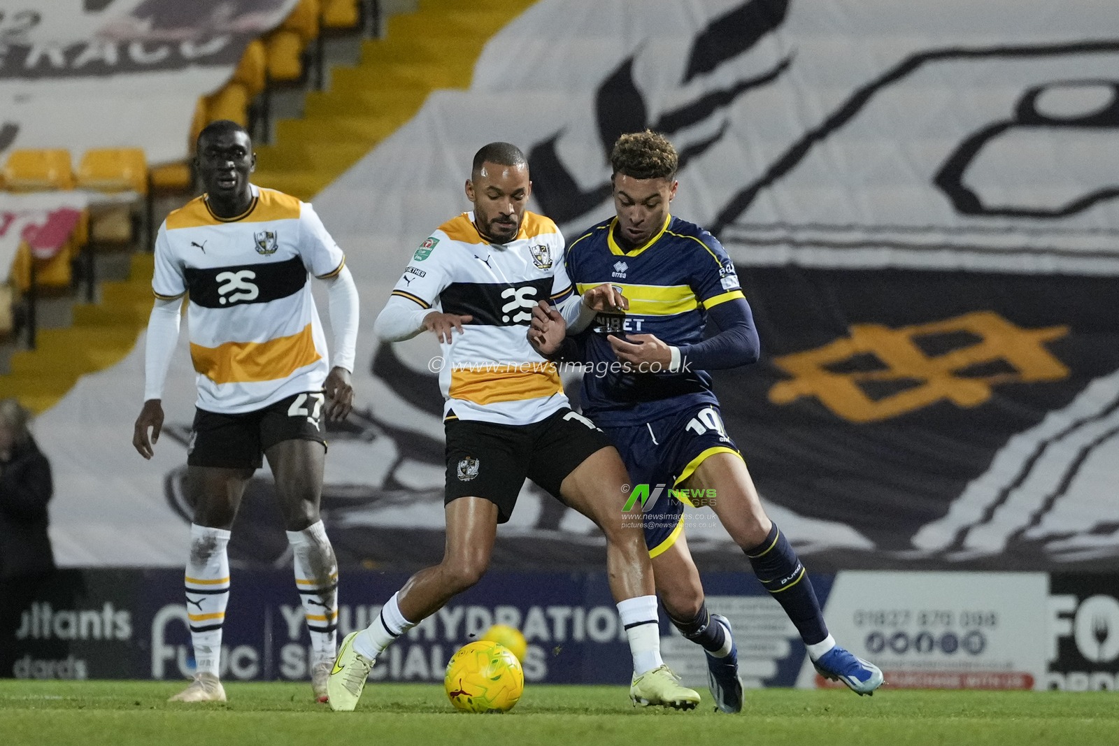 Funso Ojo #14 of Port Vale competes for the ball with Morgan Rogers #10 of Middlesbrough during the Carabao Cup Quarter Final match Port Vale vs Middlesbrough at Vale Park, Burslem, United Kingdom, 19th December 2023

(Photo by Steve Flynn/News Images)