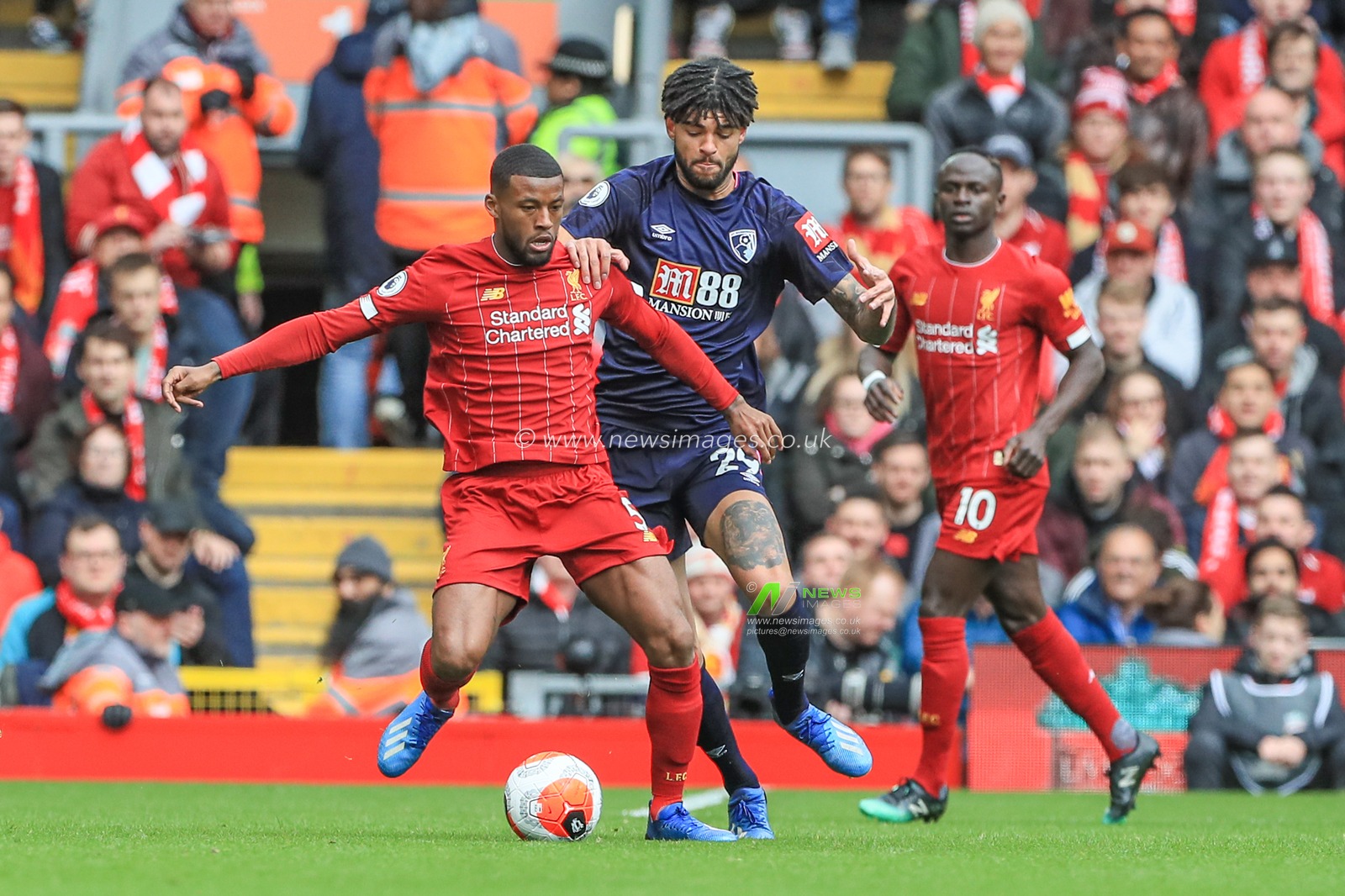 7th March 2020, Anfield, Liverpool, England; Premier League, Liverpool v Bournemouth : Georginio Wijnaldum (5) of Liverpool holds off Philip Billing of Bournemouth