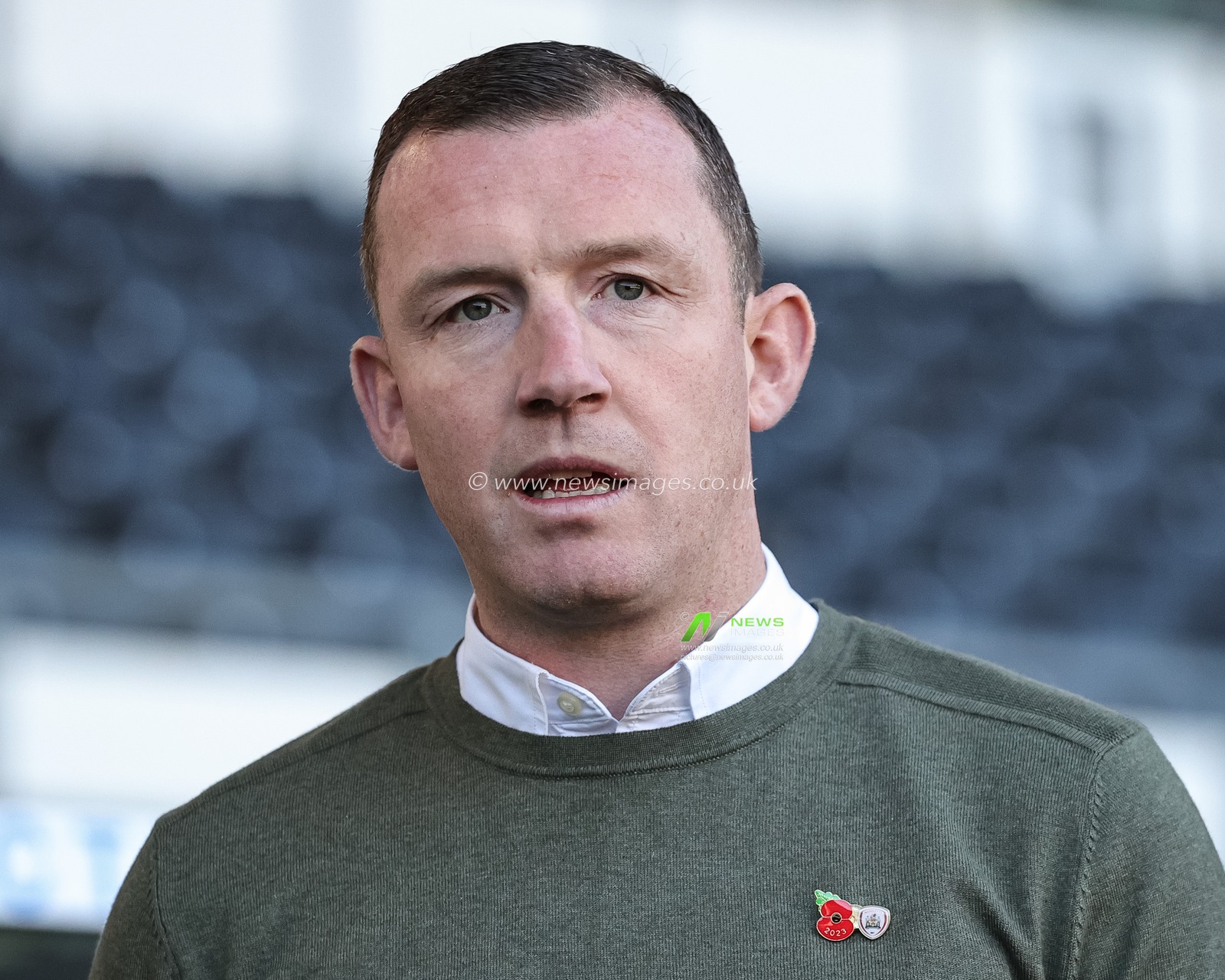 Neill Collins Head coach of Barnsley with his remembrance poppy pin badge during the Sky Bet League 1 match Derby County vs Barnsley at Pride Park Stadium, Derby, United Kingdom, 11th November 2023

(Photo by Mark Cosgrove/News Images)