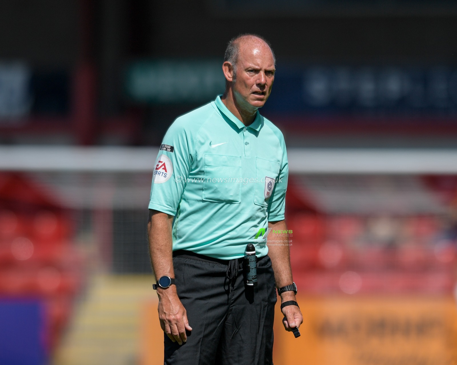 Referee Andy Haines in action during the game