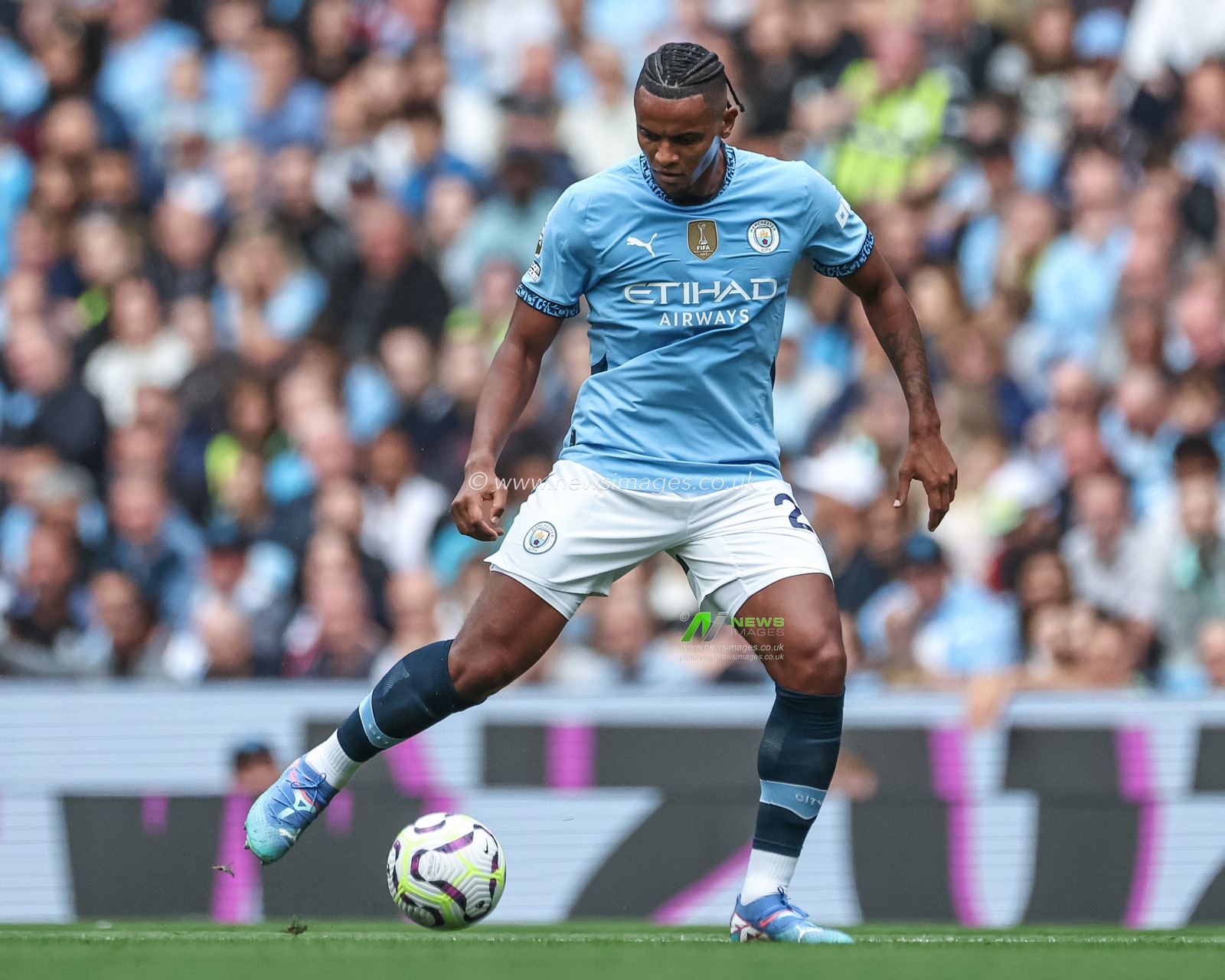 Manuel Akanji of Manchester City with the ball during the Premier League match Manchester City vs Brentford at Etihad Stadium, Manchester, United Kingdom, 14th September 2024

(Photo by Mark Cosgrove/News Images)