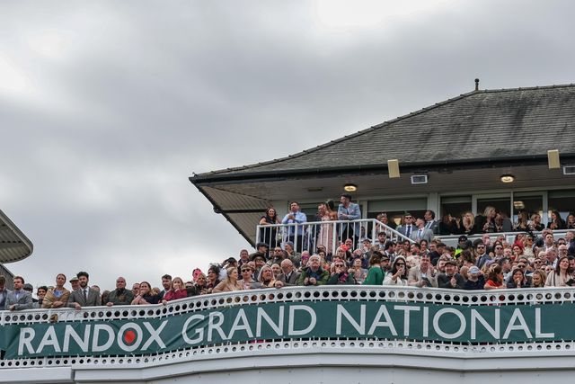 Racegoers look on as the 16:00 Randox Grand National Handicap Chase gets under way  during the Randox Grand National Day 2024 at Aintree Racecourse, Liverpool, United Kingdom, 13th April 2024

(Photo by Mark Cosgrove/News Images)