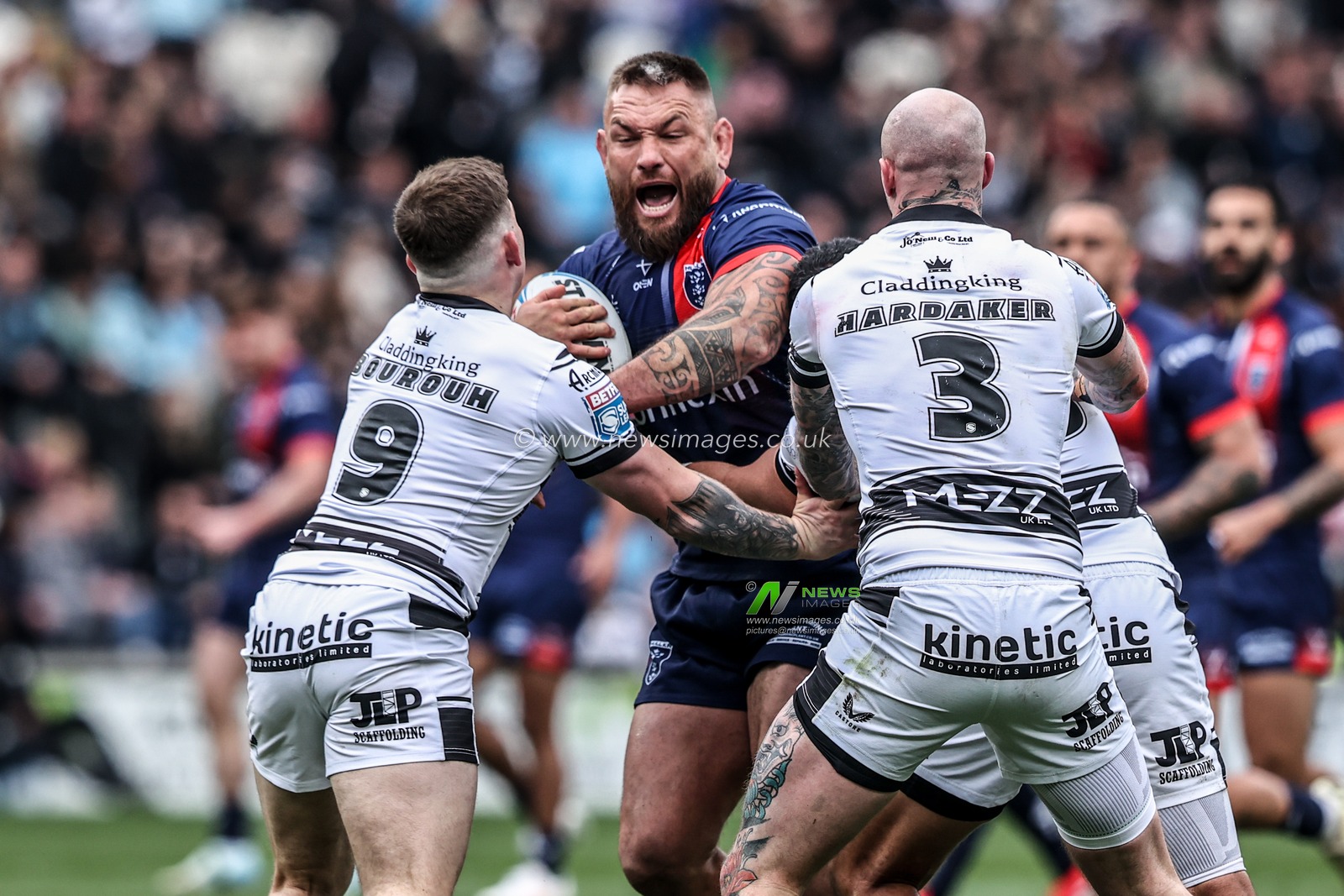 Jared Waerea-Hargreaves of Hull KR is tackled by Amir Bourouh of Hull FC and Zak Hardaker of Hull FC during the Betfred Super League Round 8 match Hull FC vs Hull KR at MKM Stadium, Hull, United Kingdom, 18th April 2025

(Photo by Alfie Cosgrove/News Images)