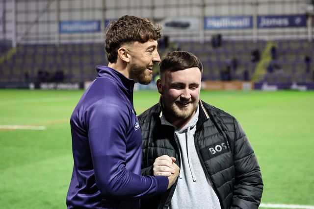 Matty Ashton of Warrington Wolves shakes hands with Luke Littler during the Betfred Super League Round 2 match Warrington Wolves vs Catalans Dragons at Luke Littler Stadium, Warrington, United Kingdom, 21st February 2025

(Photo by Mark Cosgrove/News Images)