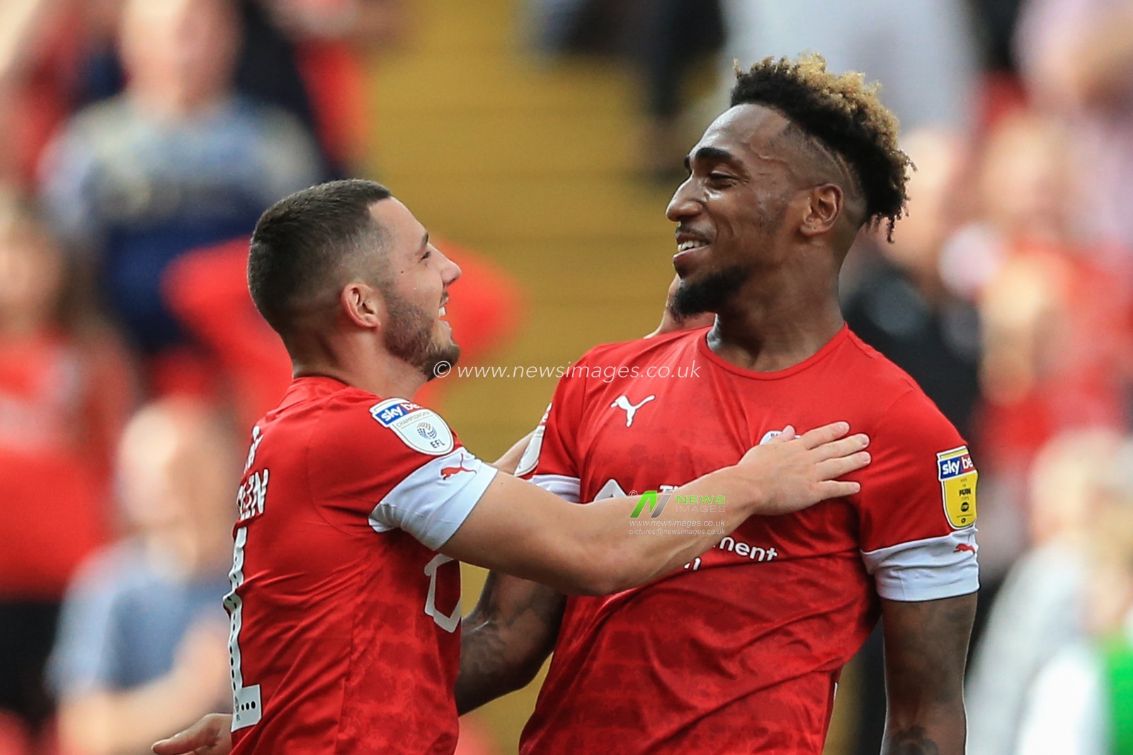 3rd August 2019, Oakwell, Barnsley, England; Sky Bet Championship, Barnsley vs Fulham ; Mallik Wilks (14) of Barnsley and Conor Chaplin (11) of Barnsley celebrate Barnsleyâ€™s 1-0 win 


Credit: Mark Cosgrove/News Images

English Football League images are subject to DataCo Licence
