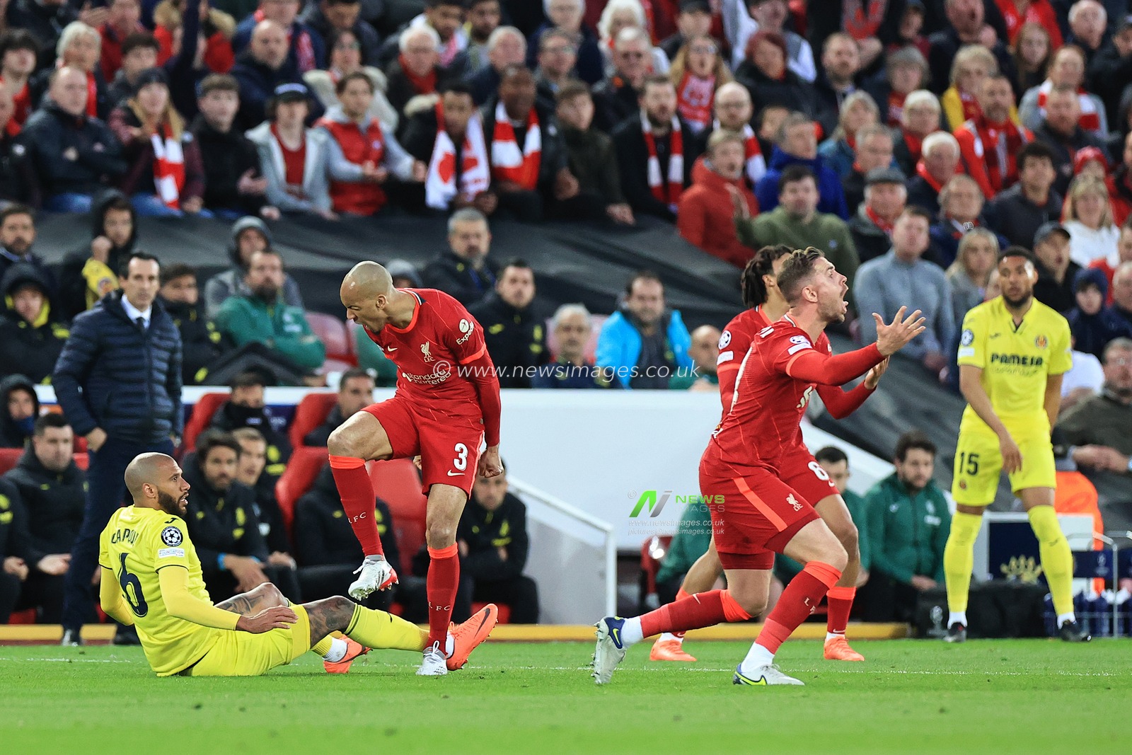 Fabinho #3 of Liverpool reacts to Ã‰tienne Capoue #6 of Villarreal