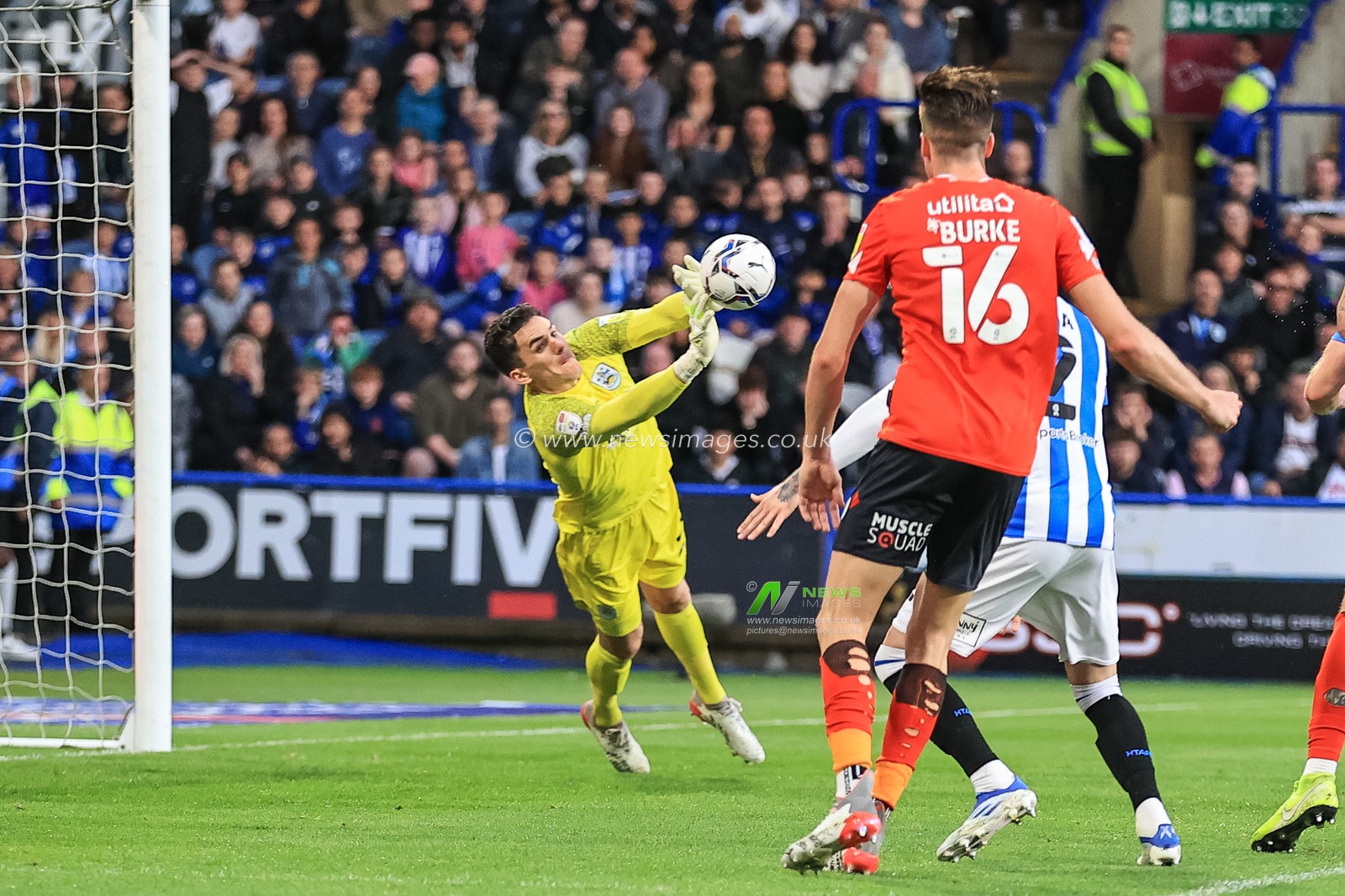 Lee Nicholls #21 of Huddersfield Town makes a save during the game