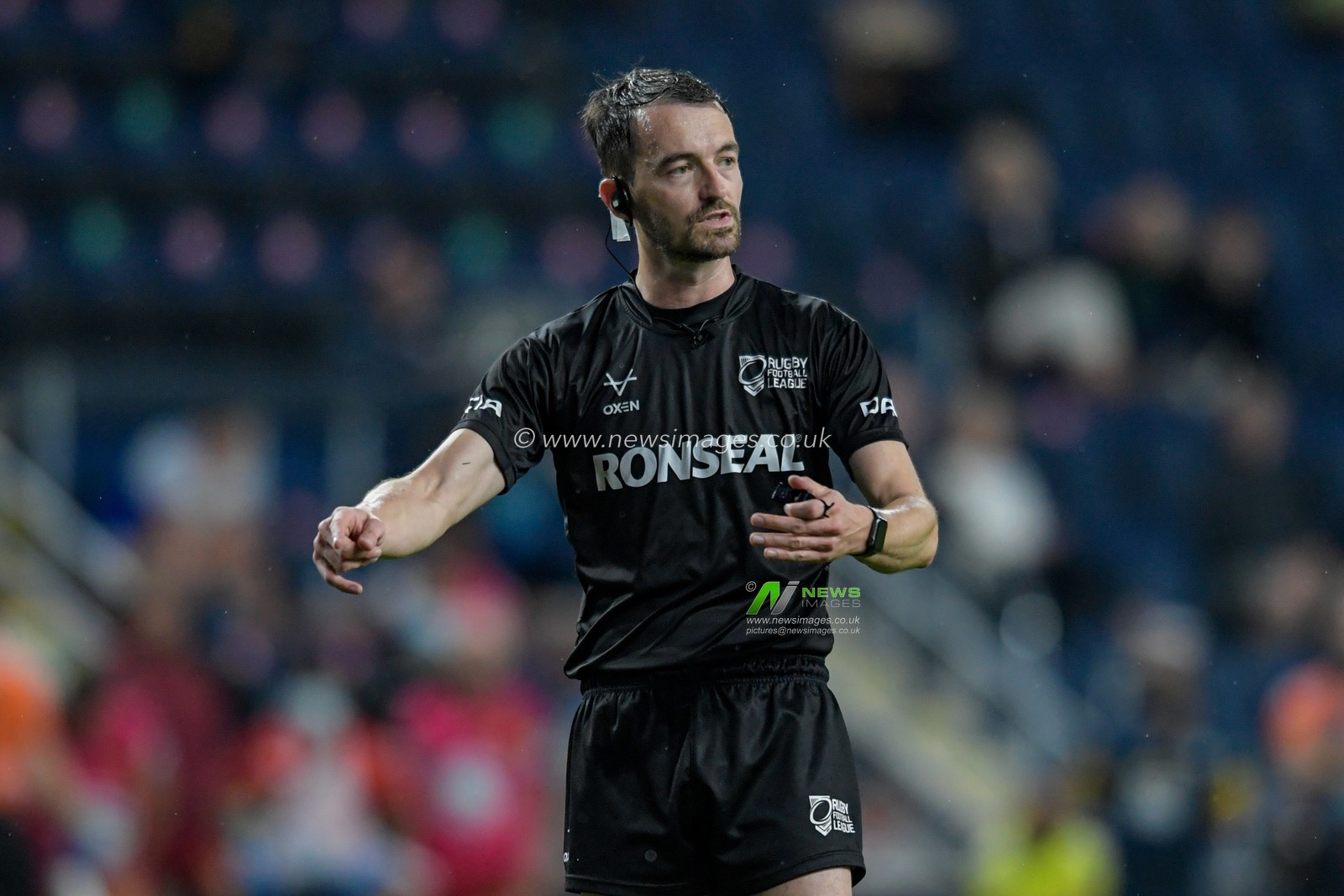 Referee James Child in action during the game