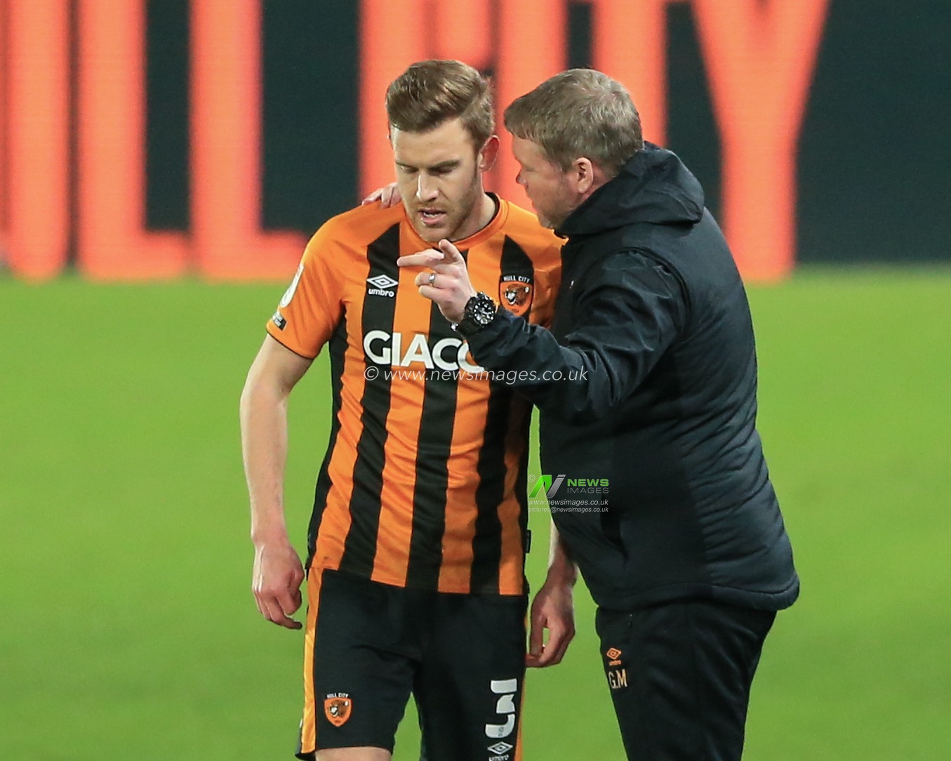 Grant McCann manager of Hull City gives Callum Elder #3 of Hull City instructions