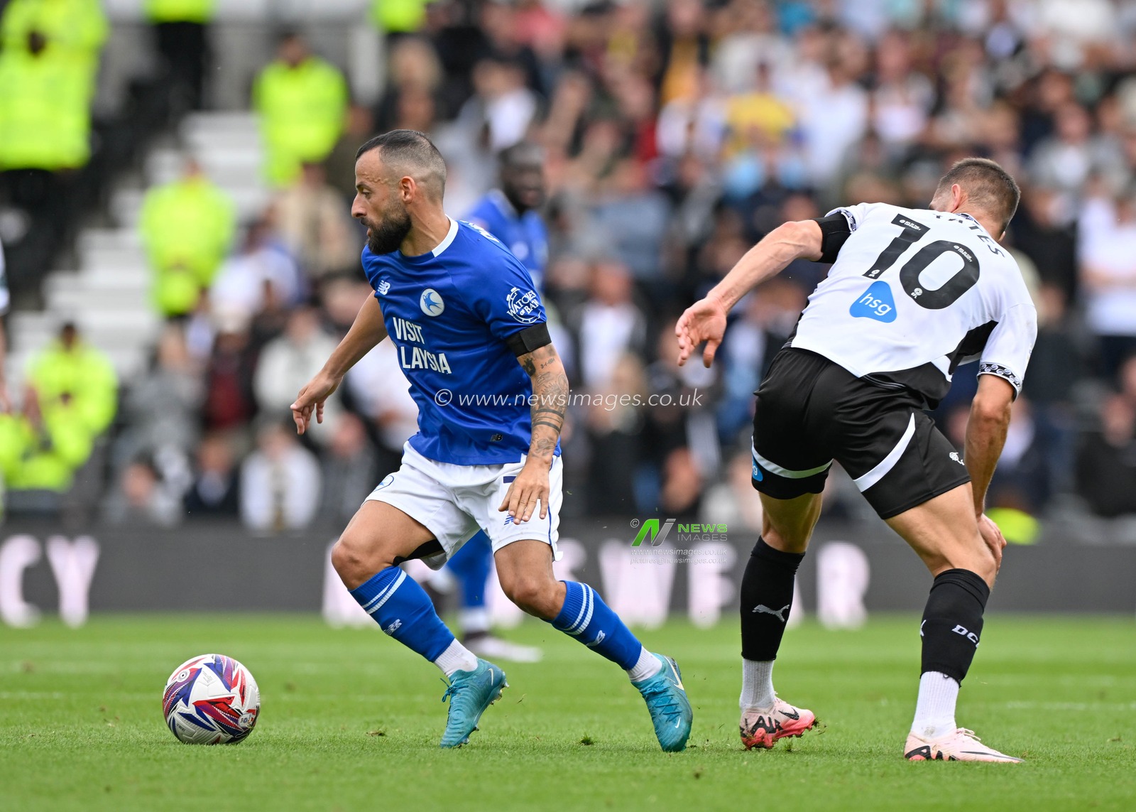 Manolis SIOPIS (Cardiff City)wins battle for the ball from Callum ELDER (Derby County) during the Sky Bet Championship match Derby County vs Cardiff City at Pride Park Stadium, Derby, United Kingdom, 14th September 2024

(Photo by Mark Dunn/News Images)