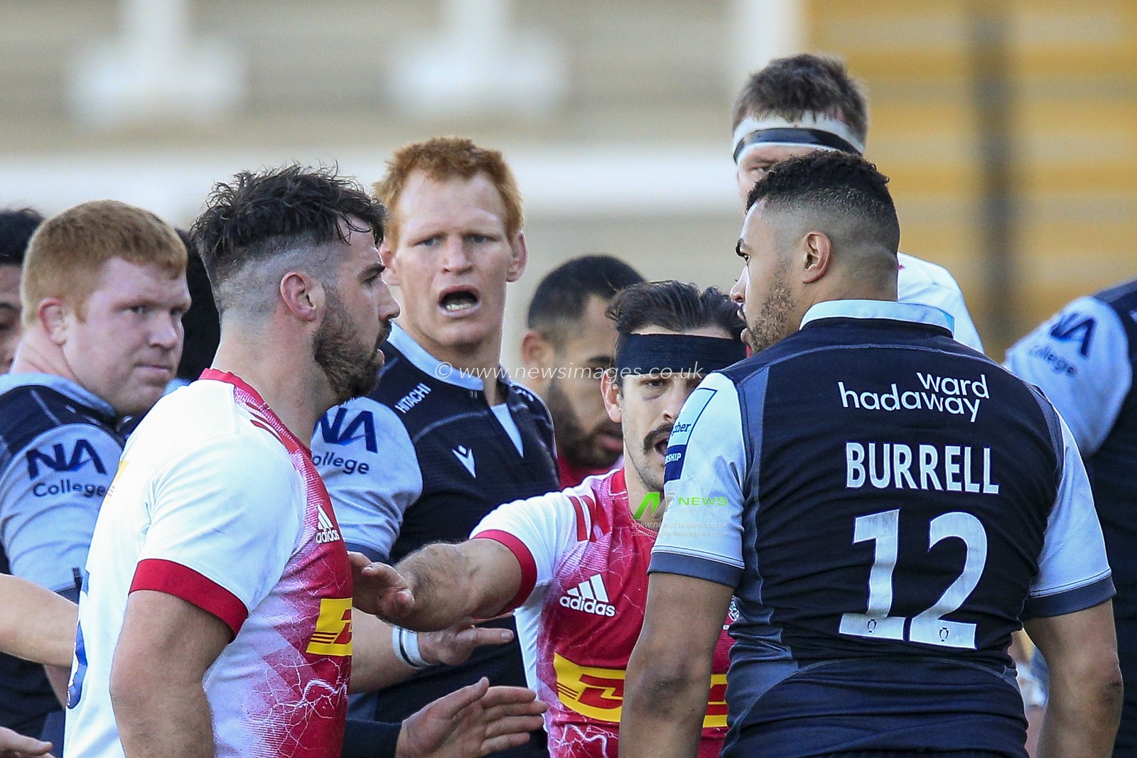 Luther Burrell of Newcastle Falcons and Scott Baldwin of Harlequins stare at each other