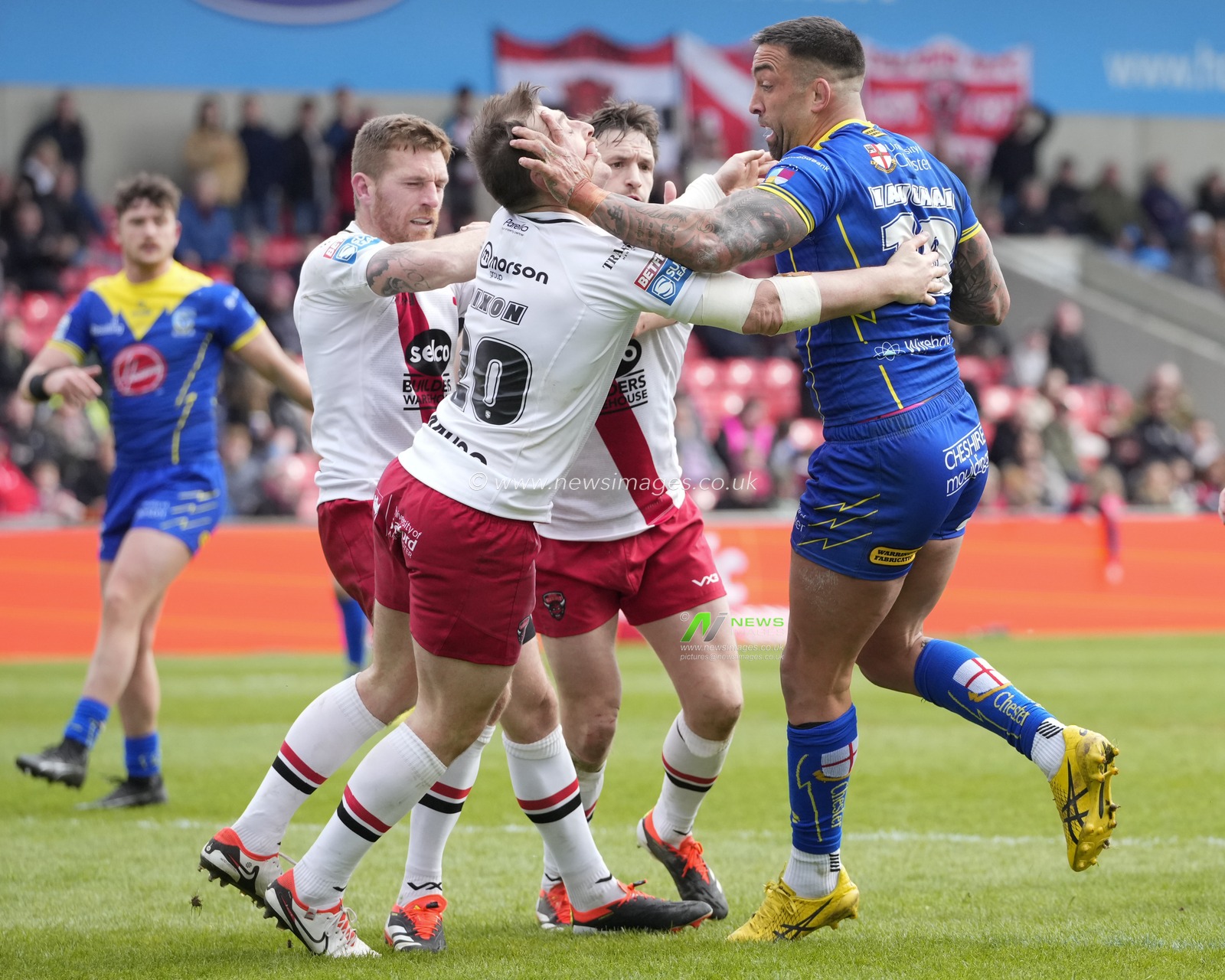 Paul Vaughan of Warrington Wolves drives through the Salford Red Devils defence during the Betfred Super League Round 9 match Salford Red Devils vs Warrington Wolves at Salford Community Stadium, Eccles, United Kingdom, 27th April 2024

(Photo by Steve Flynn/News Images)