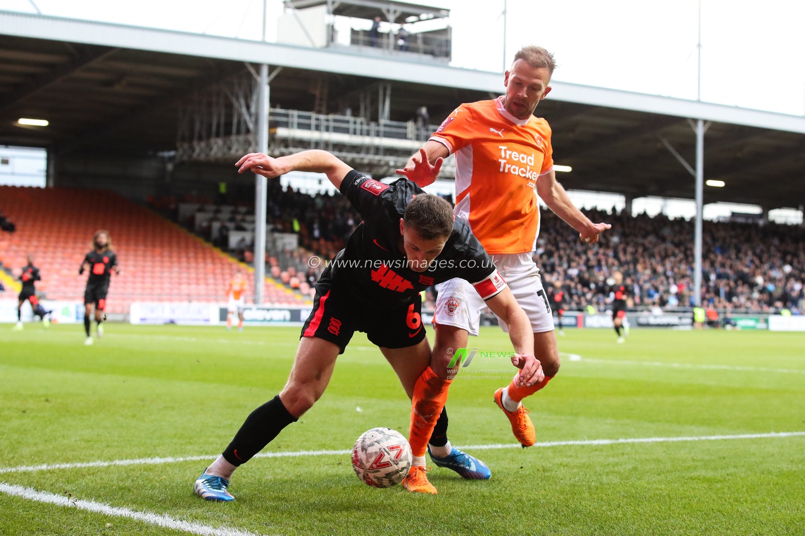 Jordan Rhodes of Blackpool tackles Krystian Bielik of Birmingham City during the Emirates FA Cup 2nd Round match Blackpool vs Birmingham City at Bloomfield Road, Blackpool, United Kingdom, 1st December 2024

(Photo by Gareth Evans/News Images)