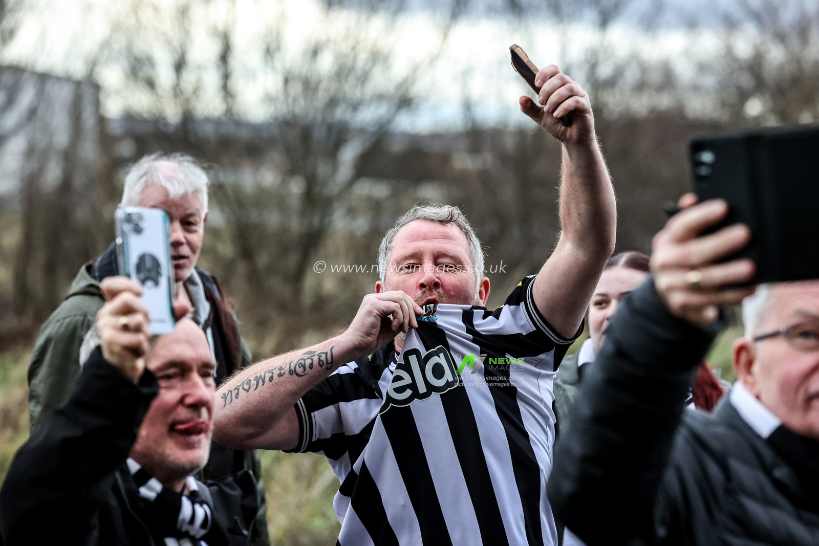 Newcastle fans are escorted to the away end by police during the Premier League match Sunderland vs Newcastle United at Stadium Of Light, Sunderland, United Kingdom, 14th December 2025

(Photo by Alfie Cosgrove/News Images)

*** GER AUT SUI OUT ***