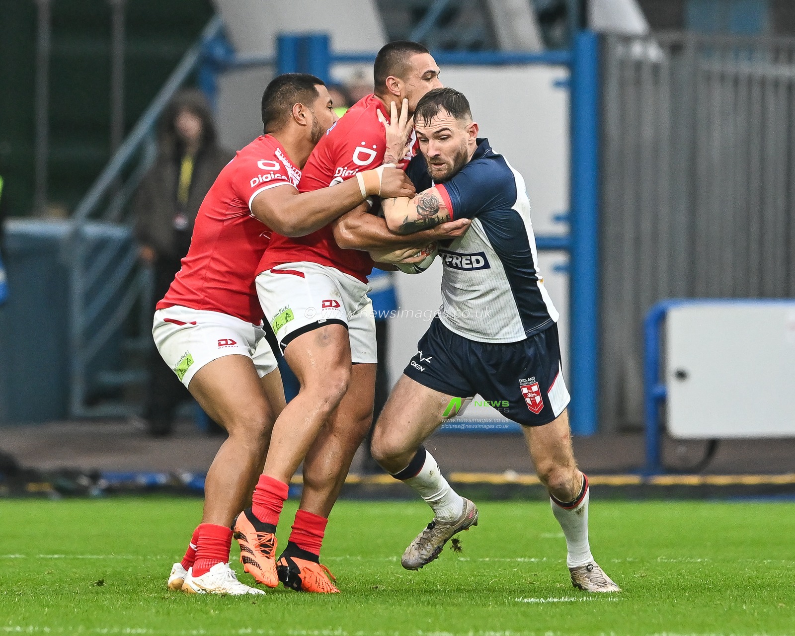 Daryl Clark of England is tackled by Tuimoala Lolohea of Tonga during the Rugby League International match England vs Tonga at John Smith's Stadium, Huddersfield, United Kingdom, 28th October 2023

(Photo by Craig Thomas/News Images)