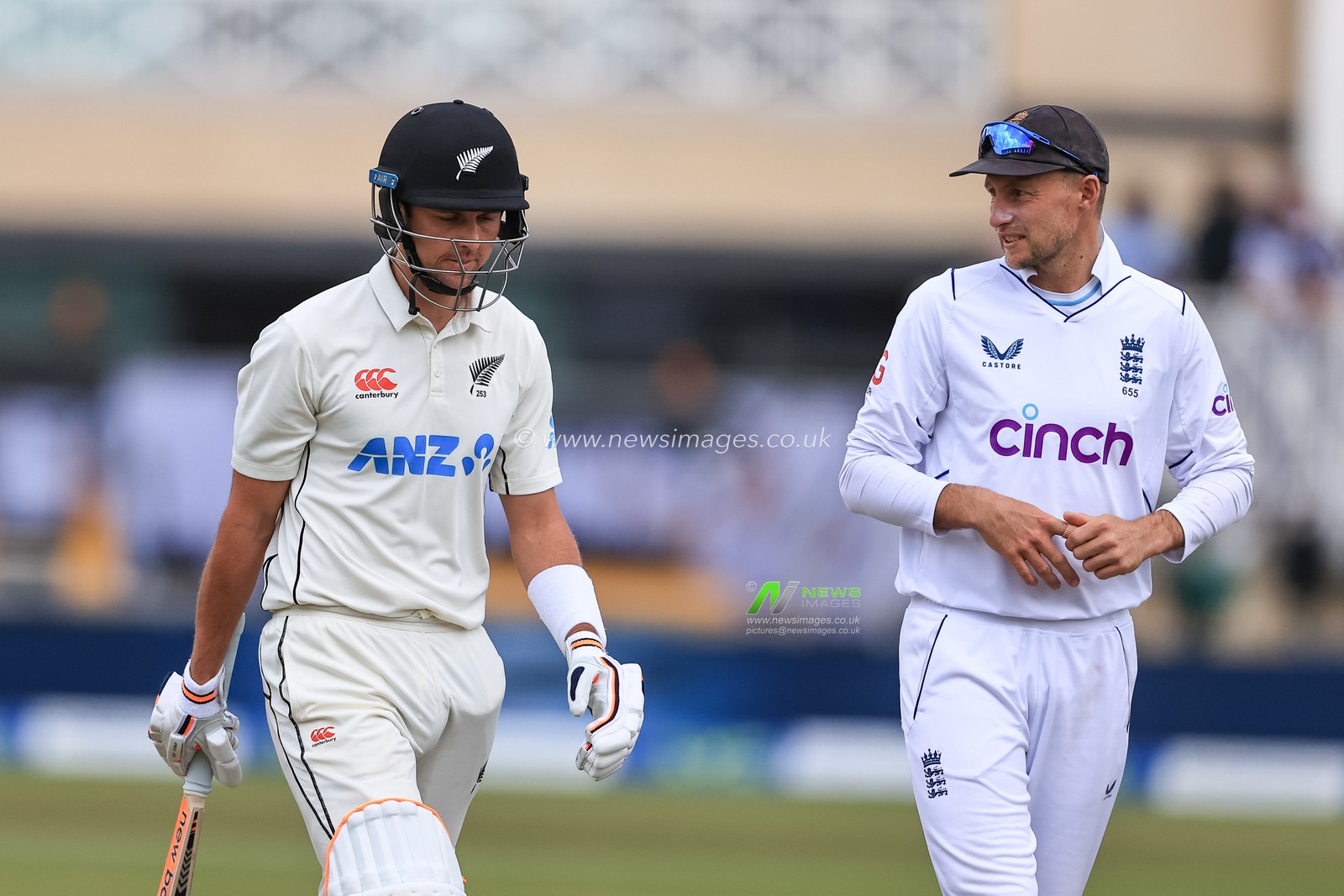 Joe Root of England speaks to Trent Boult of New Zealand after New Zealand are all out