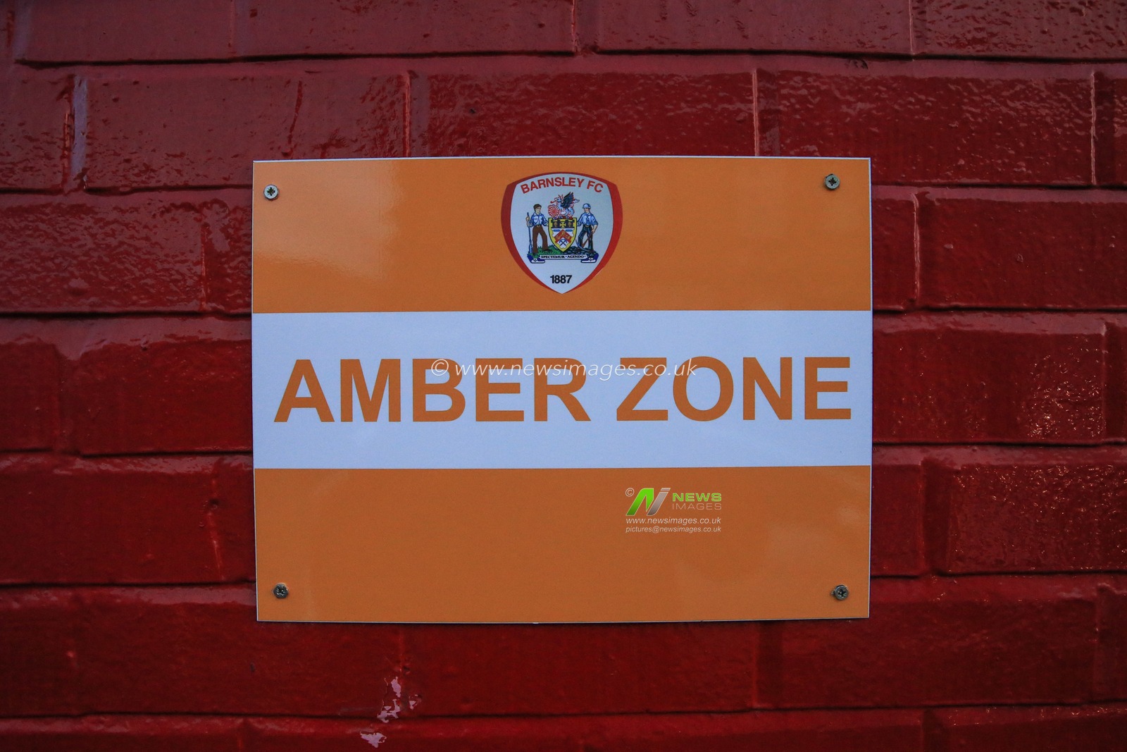 A amber zone sign outside the media entrance at Oakwell