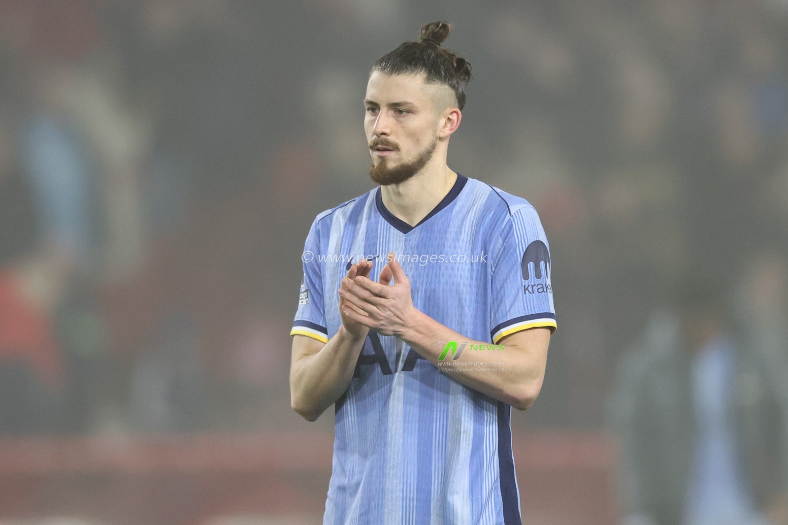 Radu DrÄƒguÈ™in of Tottenham Hotspur applauds the travelling fans during the Premier League match Nottingham Forest vs Tottenham Hotspur at City Ground, Nottingham, United Kingdom, 26th December 2024

(Photo by Alfie Cosgrove/News Images)