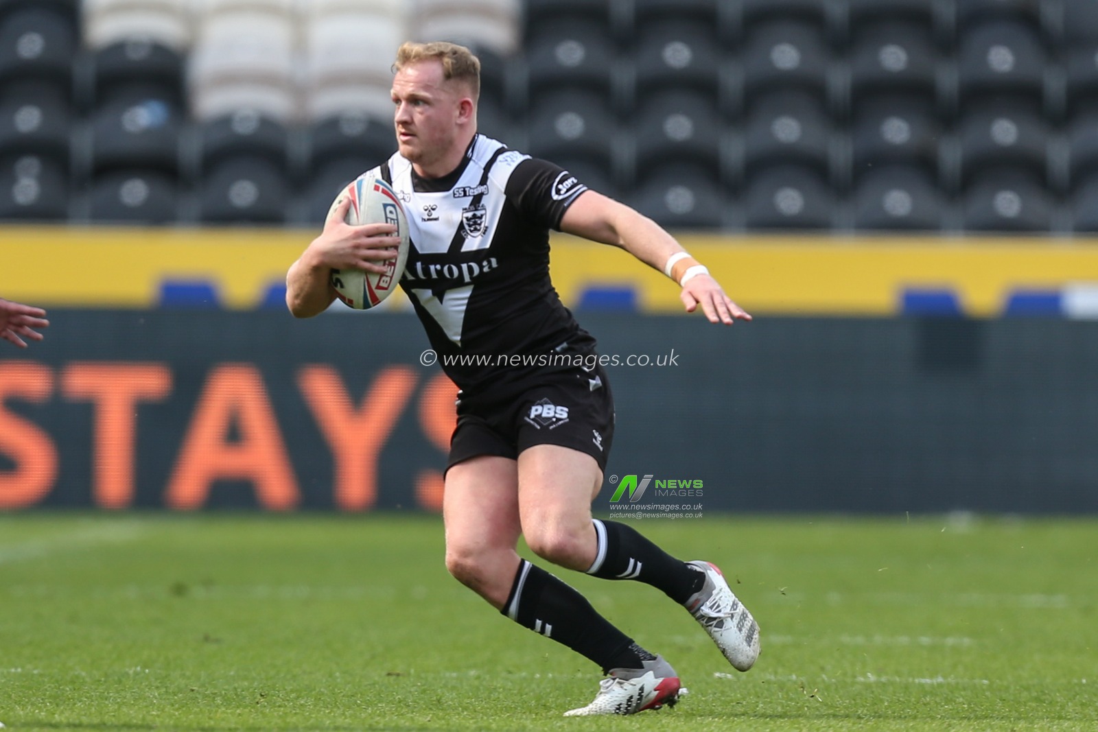 Jordan Johnstone #21 of Hull FC runs with the ball up the pitch