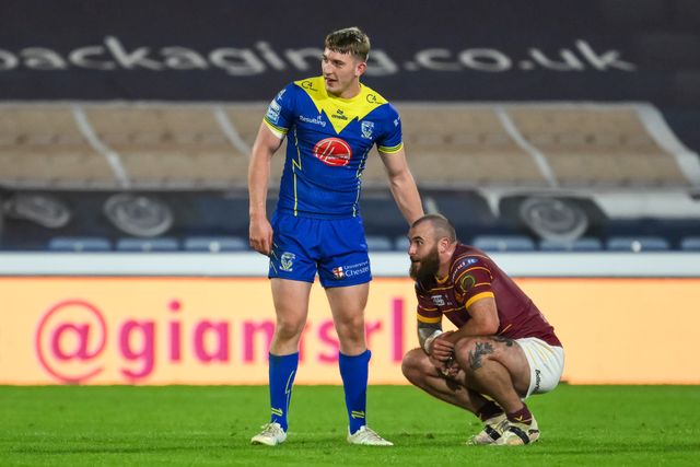 Jake Bibby of Huddersfield Giants is consoled by Matty Nicholson of Warrington Wolves during the Betfred Super League Round 26 match Huddersfield Giants vs Warrington Wolves at John Smith's Stadium, Huddersfield, United Kingdom, 14th September 2024

(Photo by Craig Thomas/News Images)